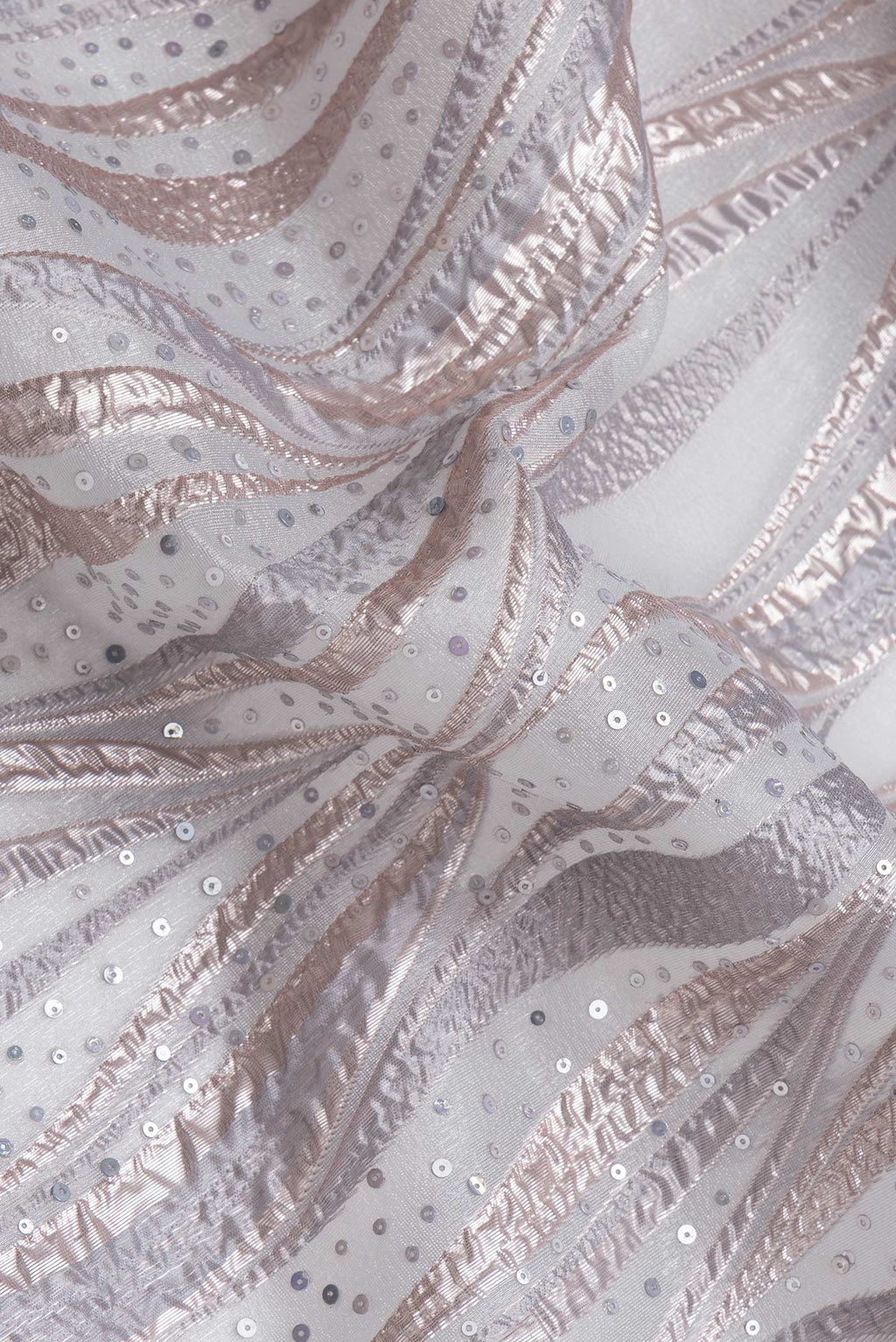 Close up of Grey Dual Tone Organza Silk Saree with Embroidery on the body and Embroidery Border.  displaying folds