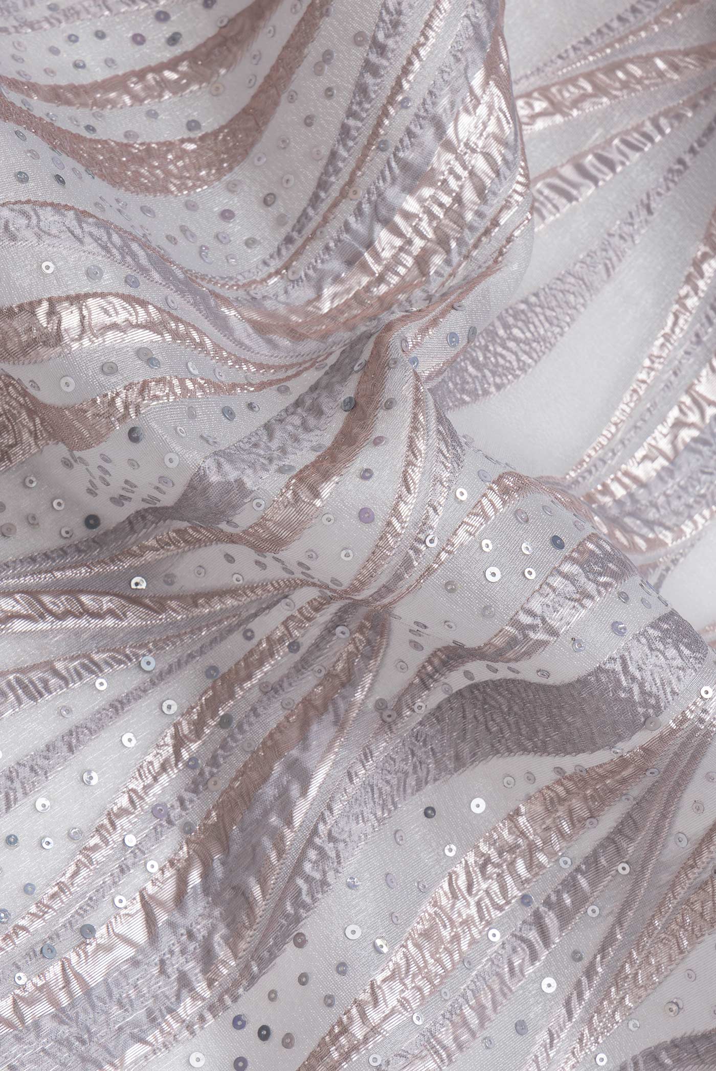 Close up of Grey Dual Tone Organza Silk Saree with Embroidery on the body and Embroidery Border.  displaying folds
