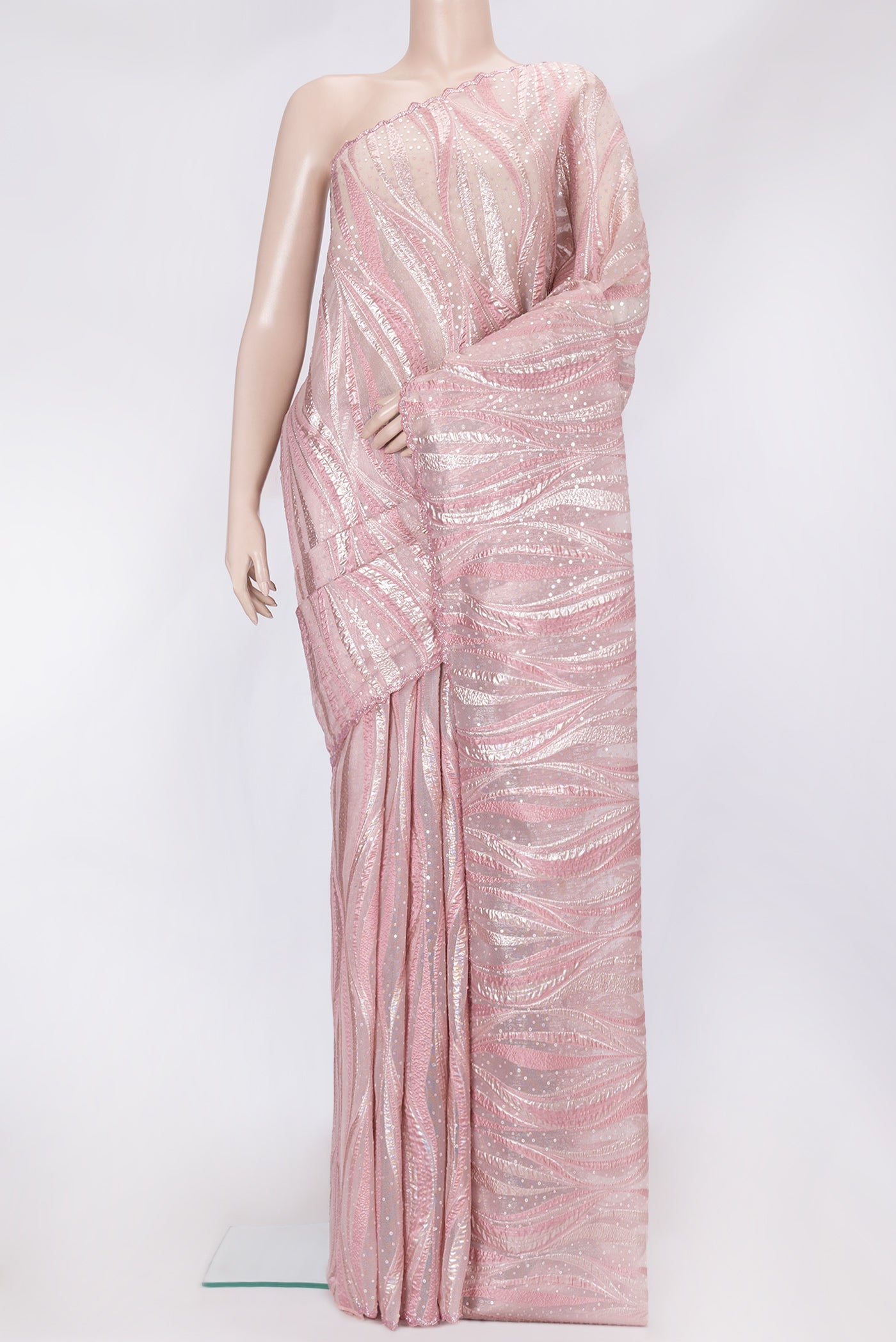 Rose Gold Dual Tone Organza Silk Saree with Embroidery on the body and Embroidery Border.  displayed on a mannequin