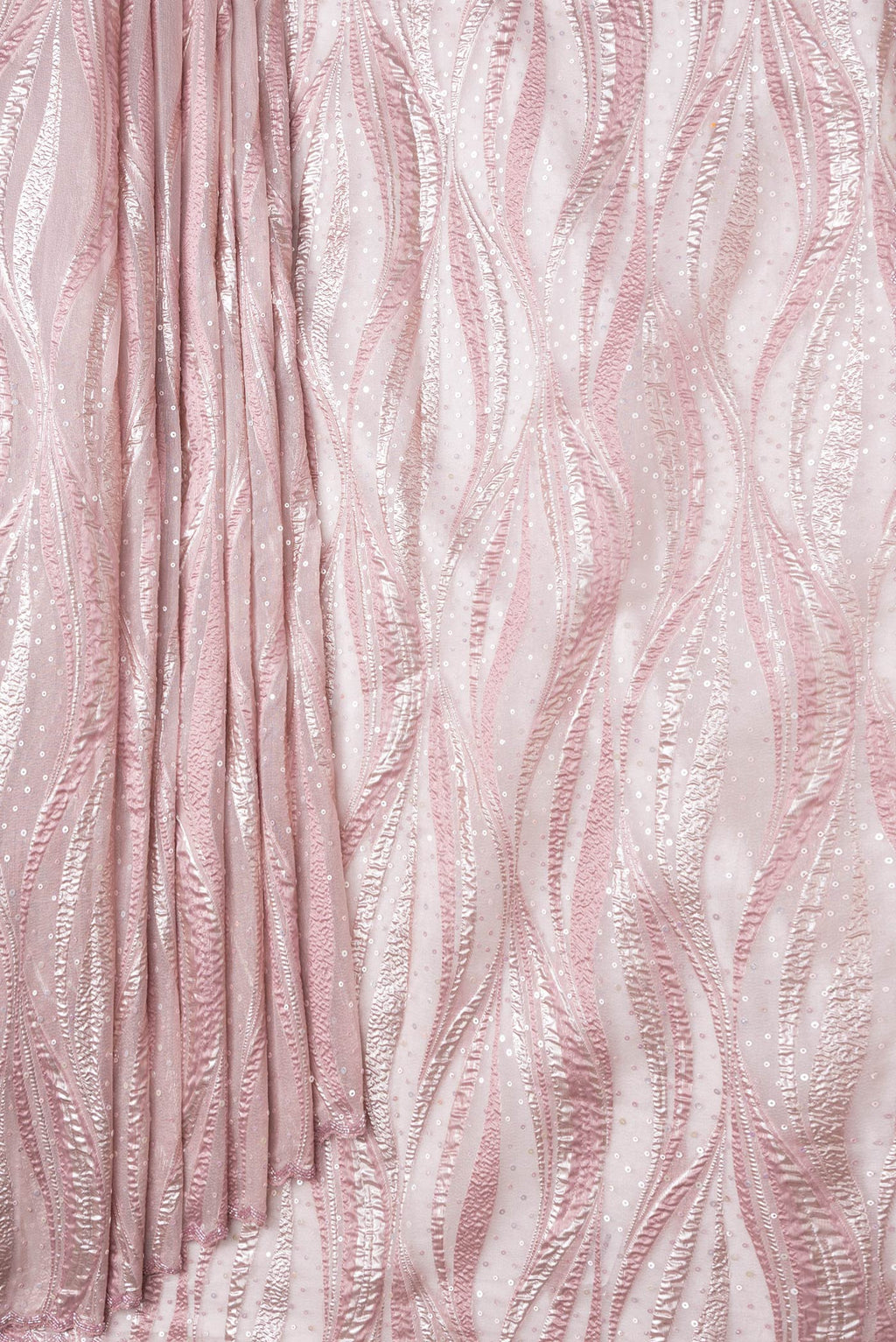 Pleats and pallu of Rose Gold Dual Tone Organza Silk Saree with Embroidery on the body and Embroidery Border. 