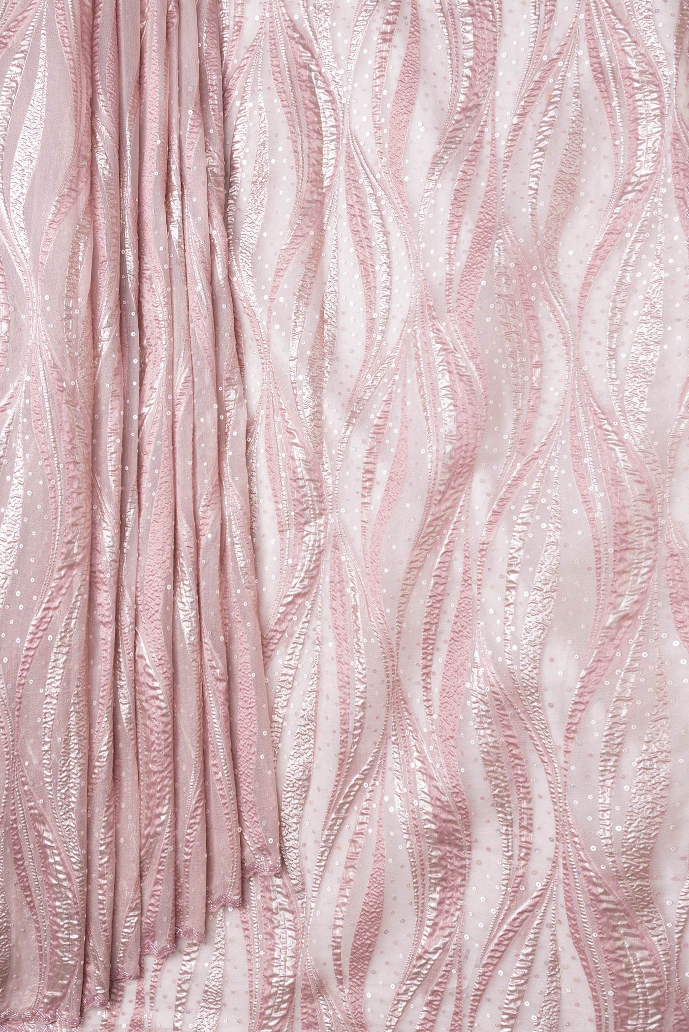 Pleats and pallu of Rose Gold Dual Tone Organza Silk Saree with Embroidery on the body and Embroidery Border. 