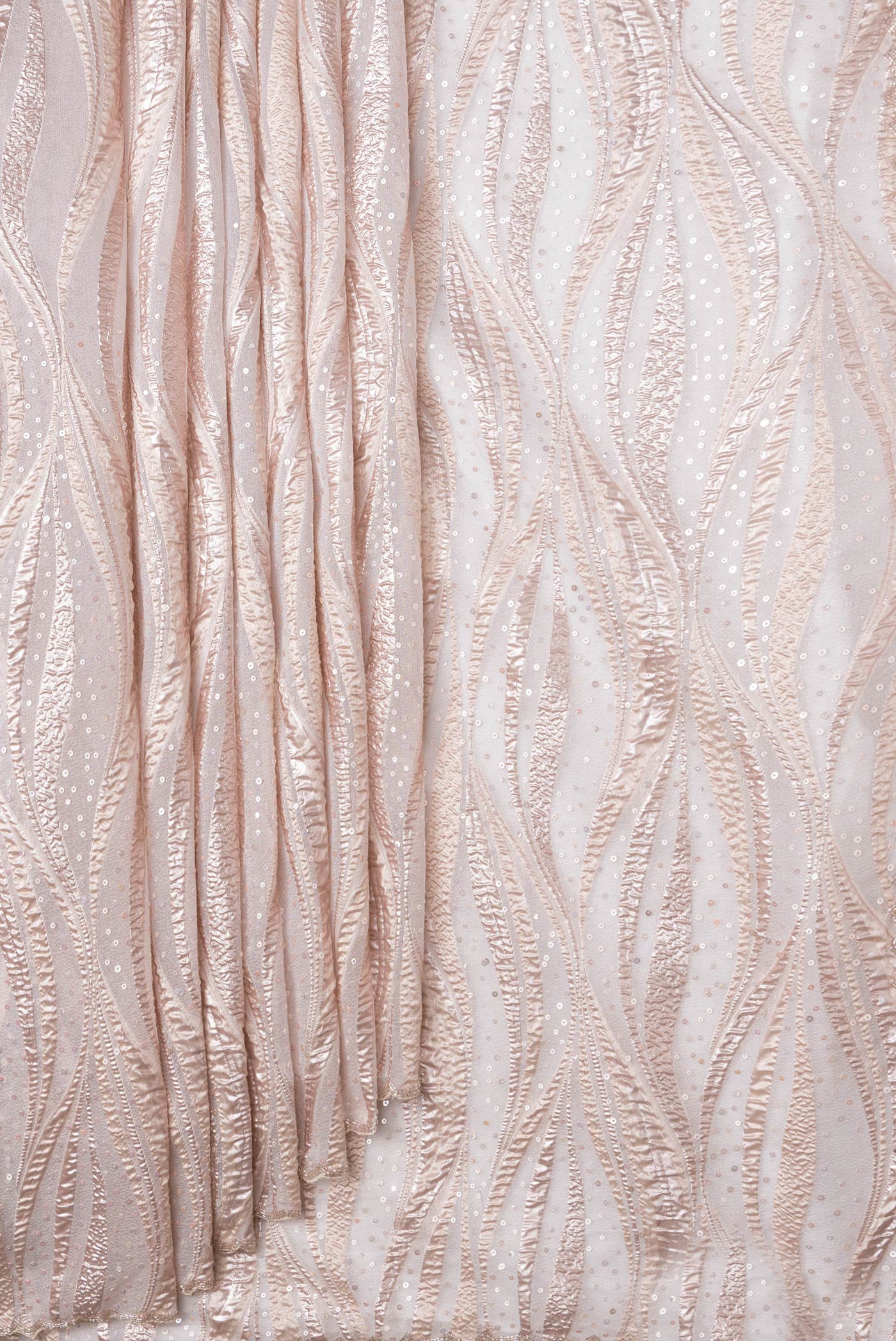 Pleats and pallu of Gold Dual Tone Organza Silk Saree with Embroidery on the body and Embroidery Border. 