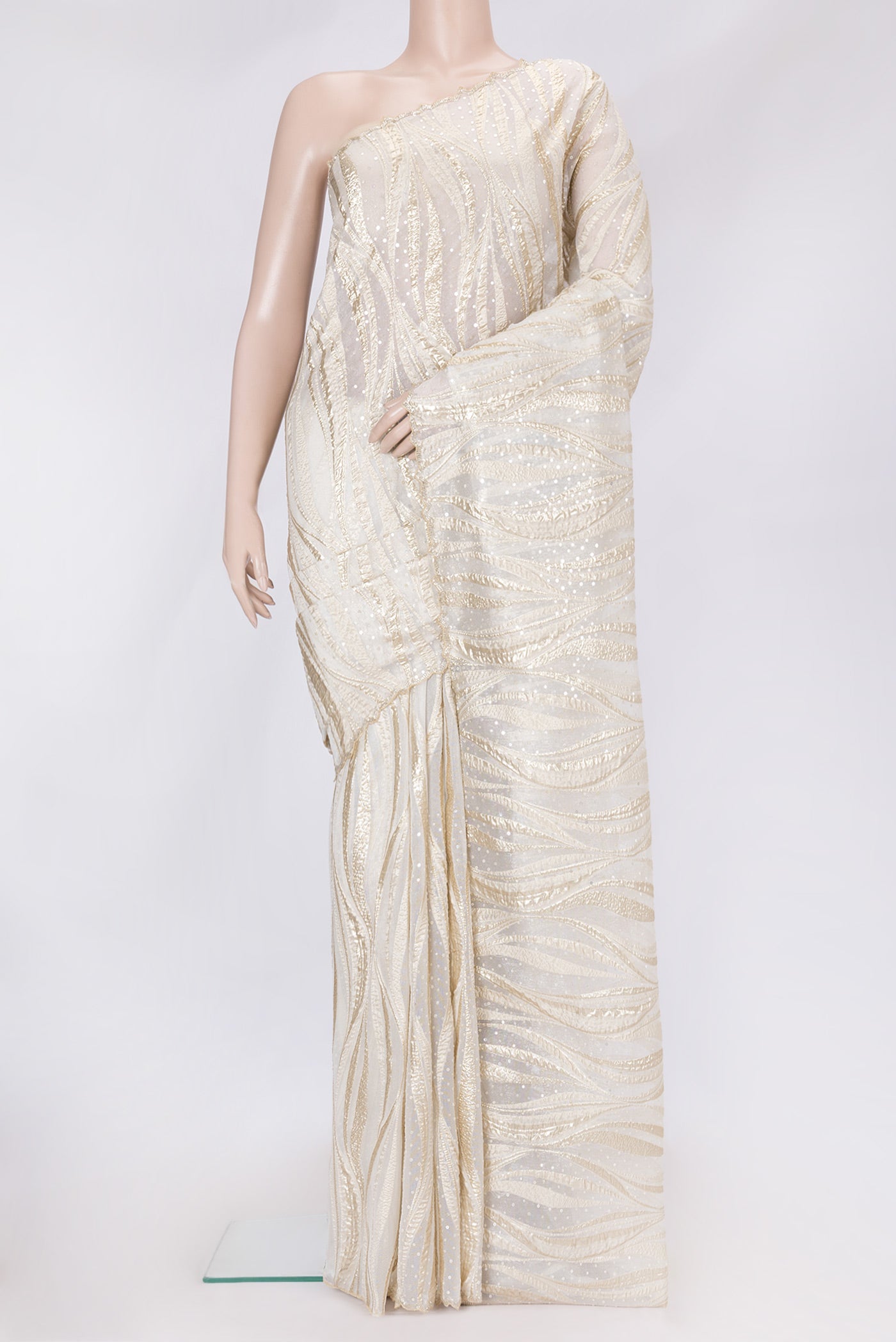 Gold Dual Tone Organza Silk Saree with Embroidery on the body and Embroidery Border.  displayed on a mannequin