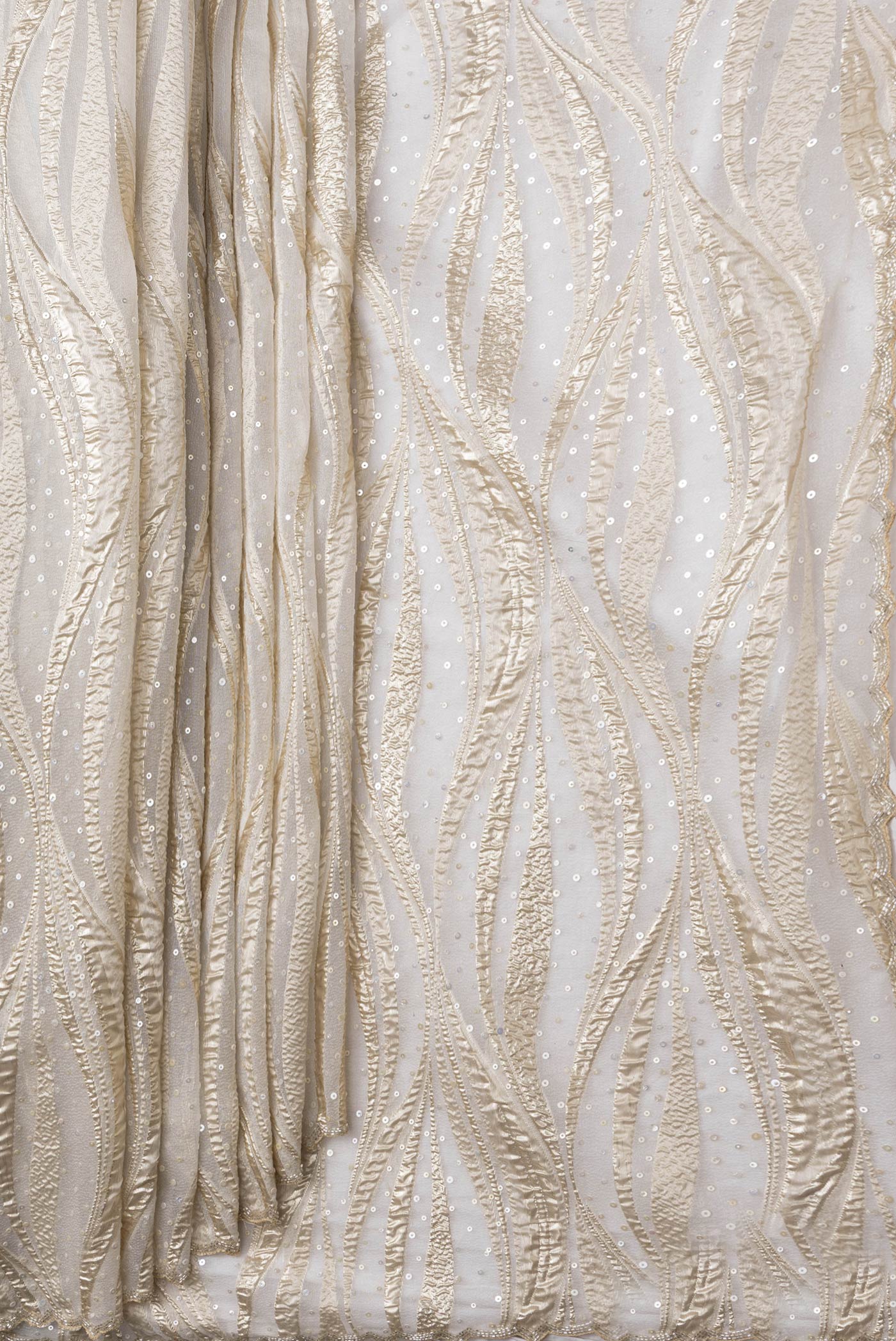 Pleats and pallu of Gold Dual Tone Organza Silk Saree with Embroidery on the body and Embroidery Border. 