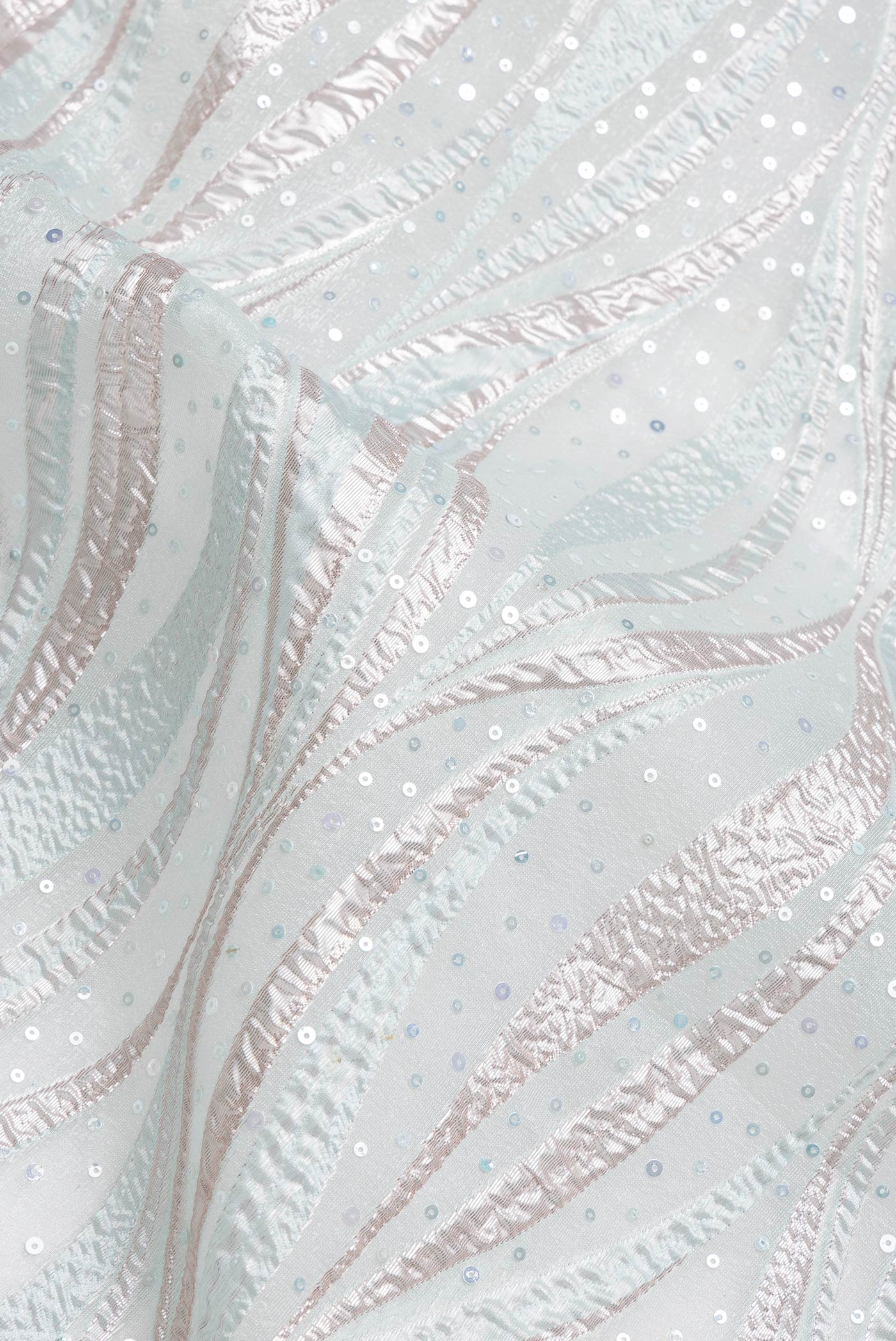 Close up of Sea Green Dual Tone Organza Silk Saree with Embroidery on the body and Embroidery Border.  displaying folds