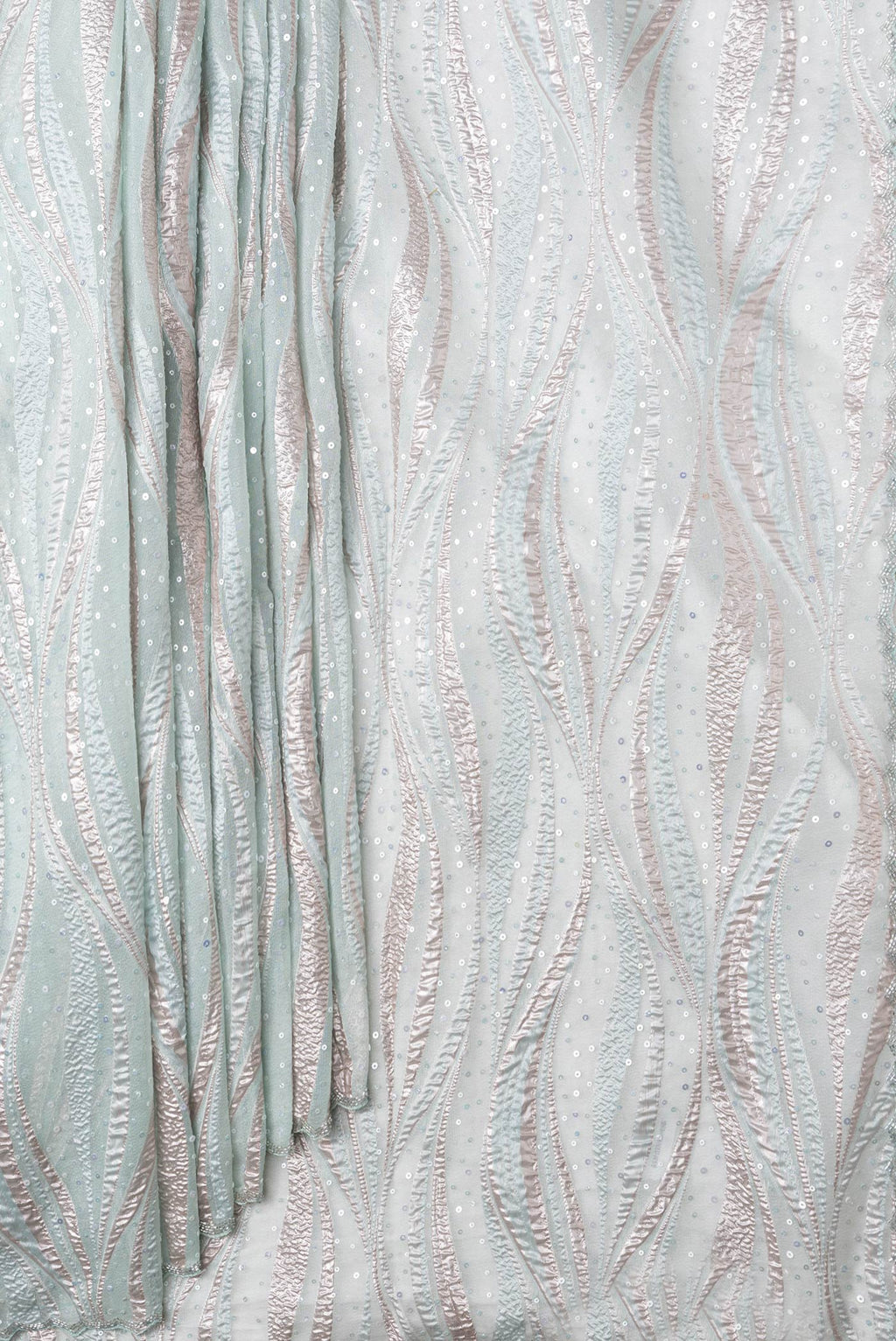 Pleats and pallu of Sea Green Dual Tone Organza Silk Saree with Embroidery on the body and Embroidery Border. 