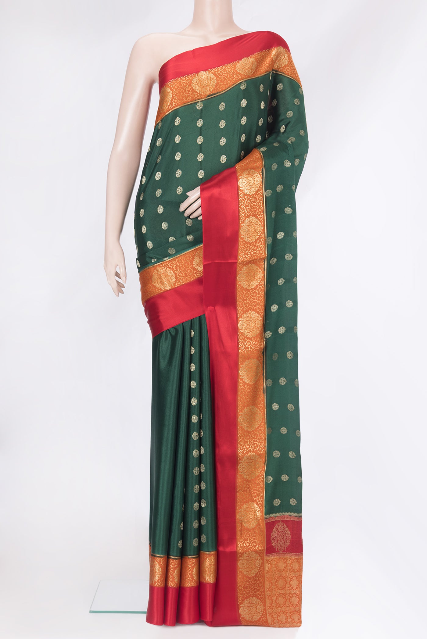 Bottle Green Mysore Silk Saree with Zari Butta on the body and Zari Border.  displayed on a mannequin
