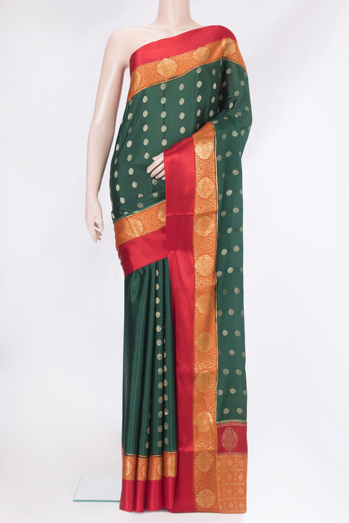Bottle Green Mysore Silk Saree with Zari Butta on the body and Zari Border.  displayed on a mannequin