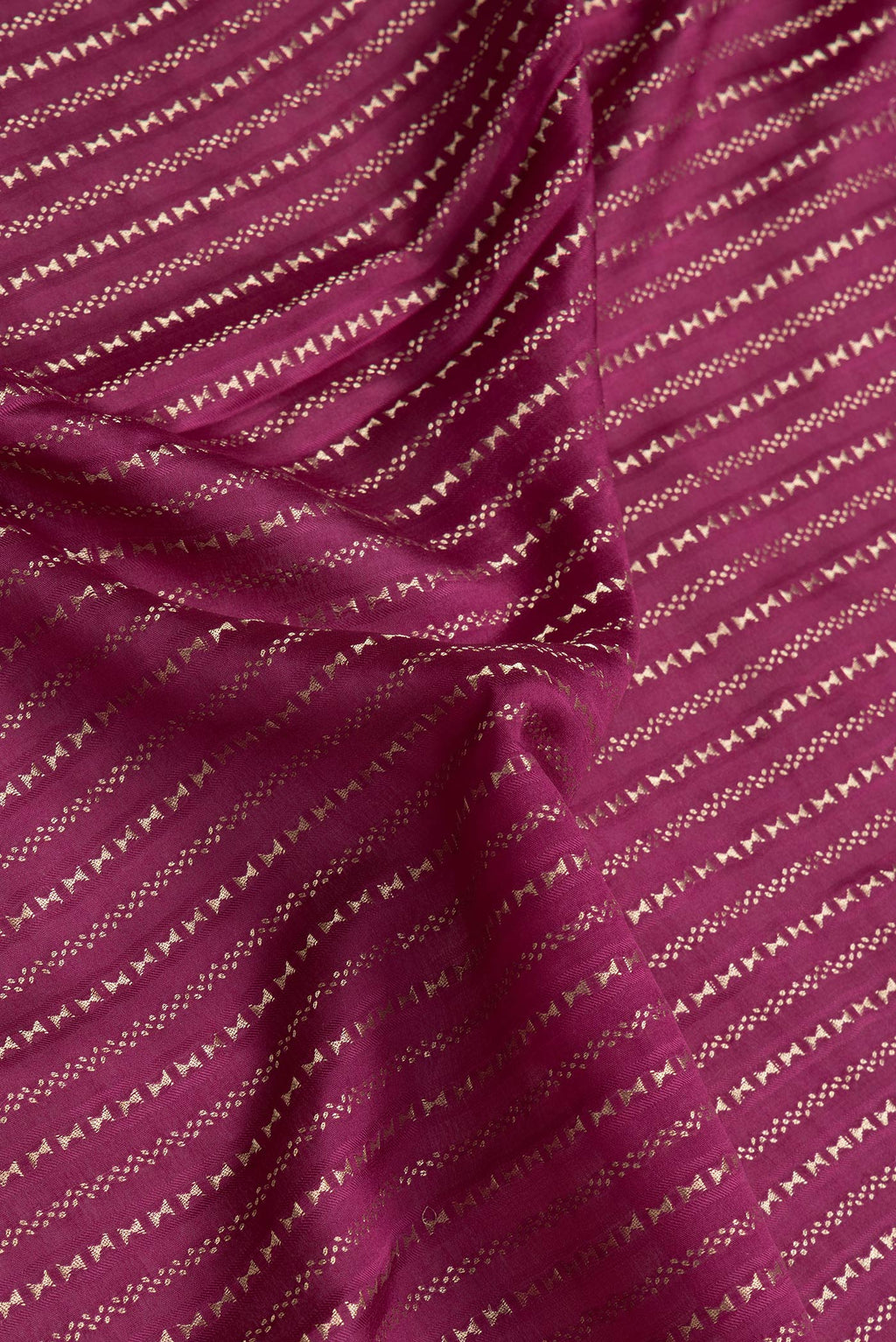 Close up of Magenta Dual Tone Mysore Silk Saree with Stripes on the body and Zari Border.  displaying folds