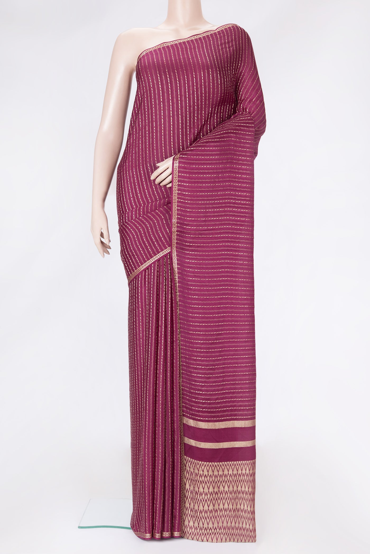 Magenta Dual Tone Mysore Silk Saree with Stripes on the body and Zari Border.  displayed on a mannequin