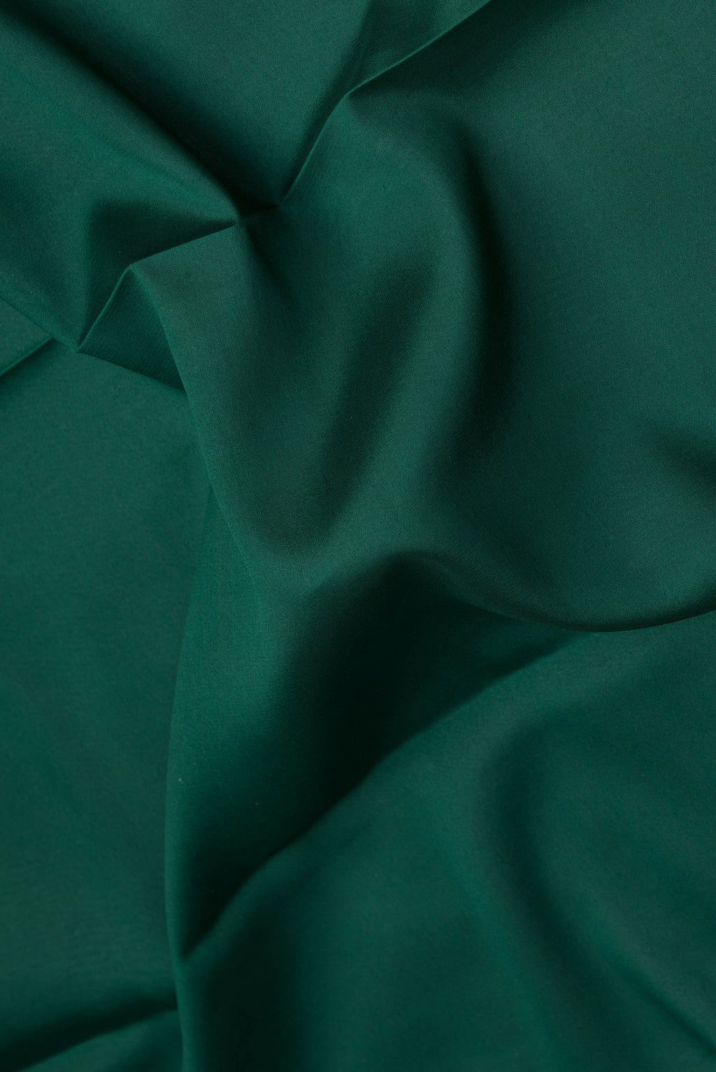 Close up of Bottle Green Mysore Silk Saree with Plain Body and Fancy Border.  displaying folds