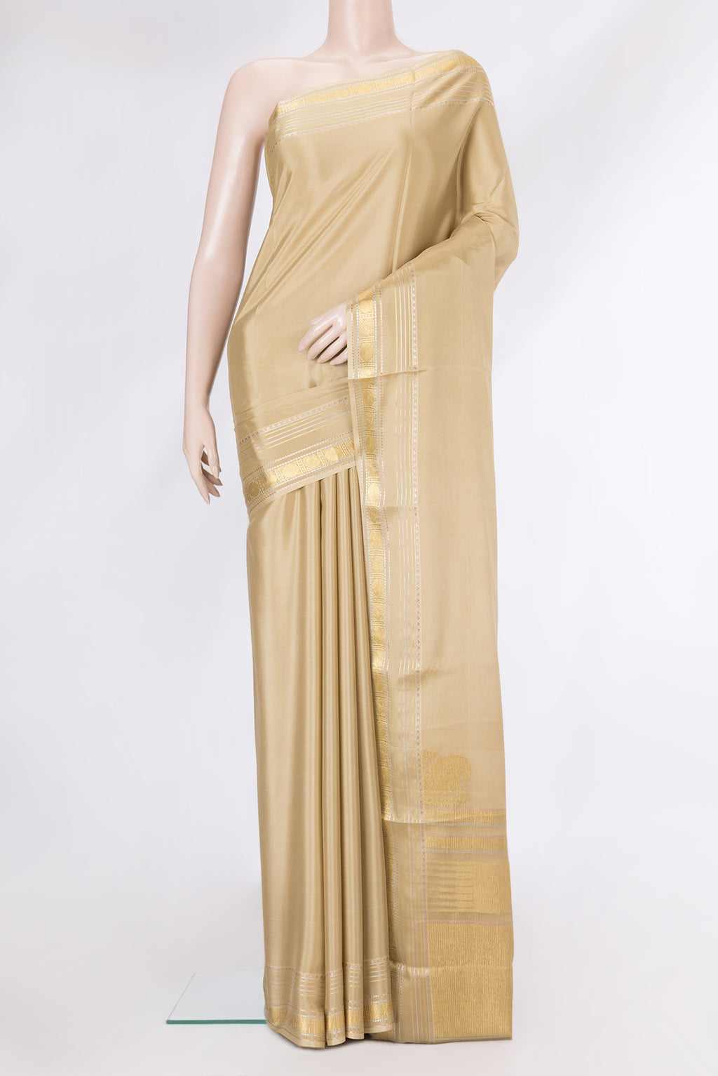 Beige Dual Tone Mysore Silk Saree with Plain Body and Zari Border.  displayed on a mannequin