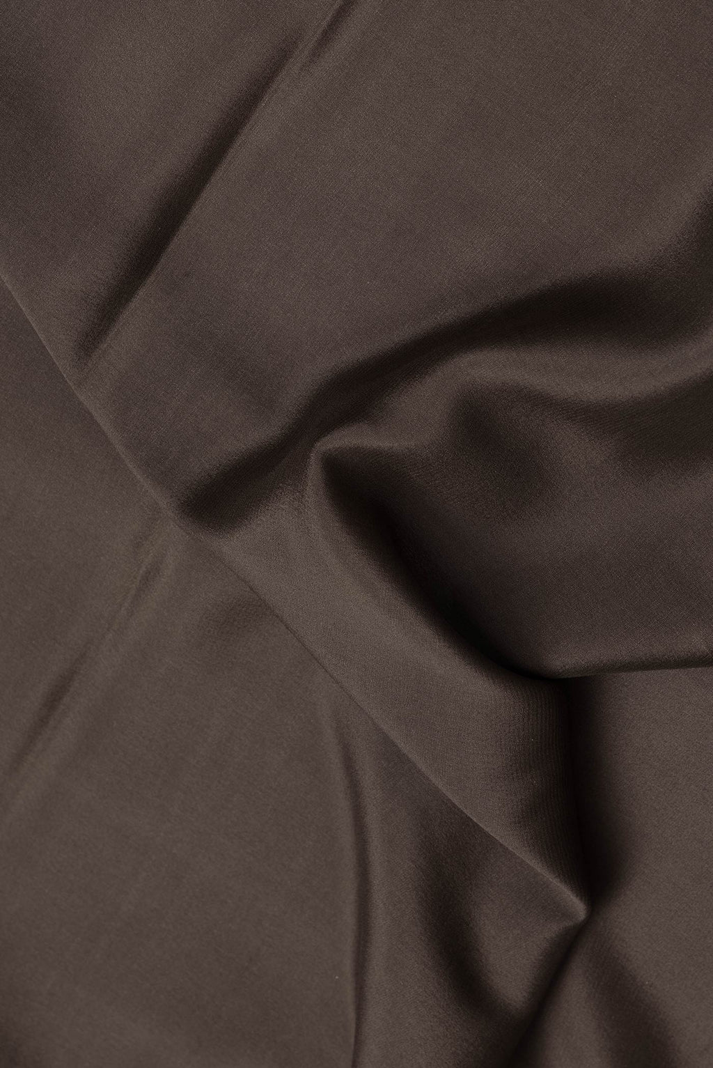 Close up of Brown Dual Tone Mysore Silk Saree with Plain Body and Fancy Border.  displaying folds
