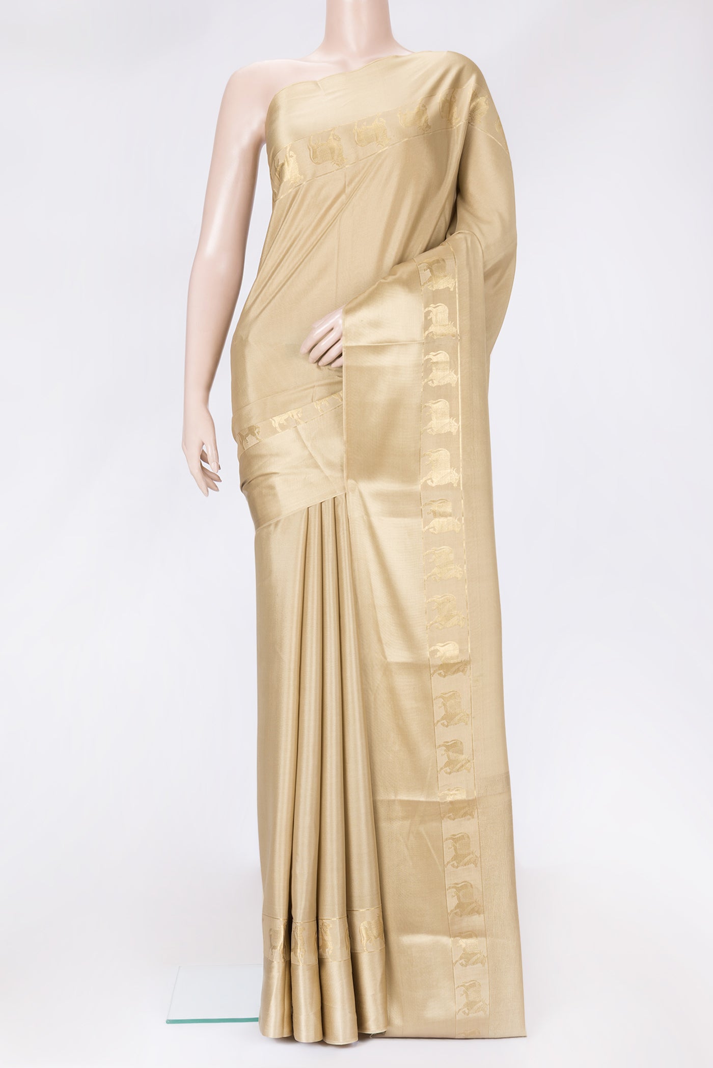 Beige Dual Tone Mysore Silk Saree with Plain Body and Fancy Border.  displayed on a mannequin