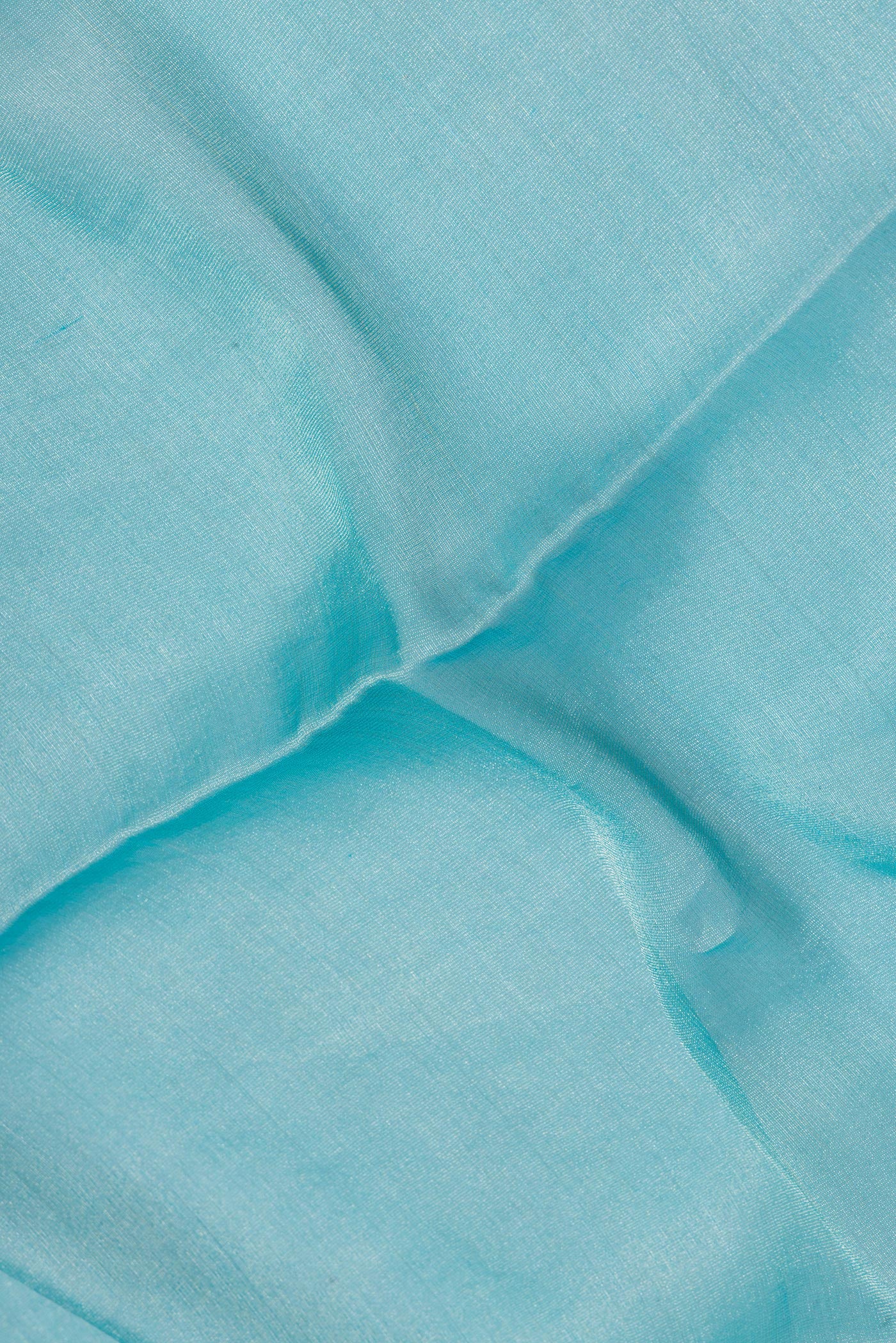 Close up of Sky Blue Mysore Georgette Saree with Plain Body and Fancy Border.  displaying folds