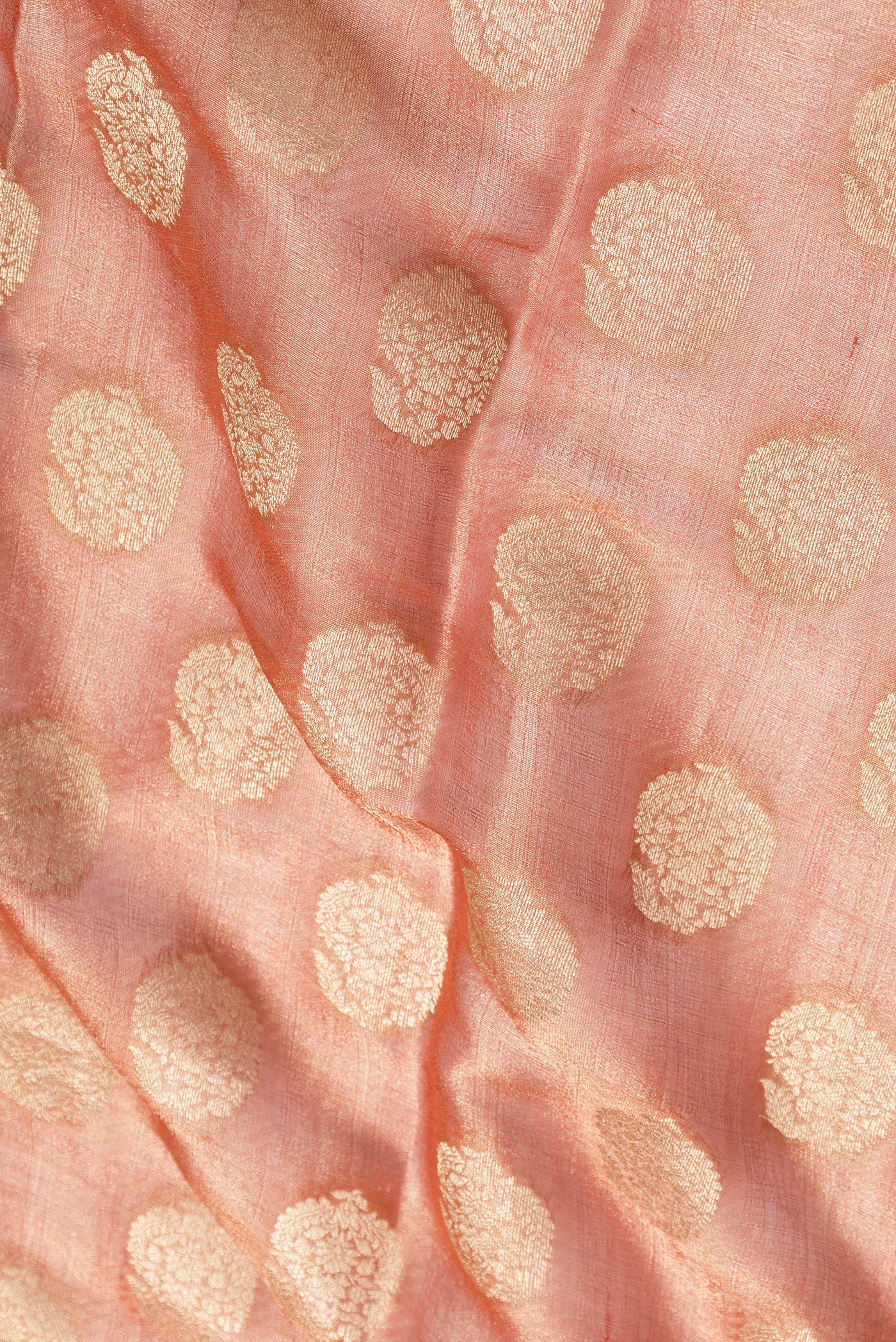 Close up of Brick Orange Dual Tone Mysore Georgette Saree with Zari Brocade on the body and Zari Border.  displaying folds