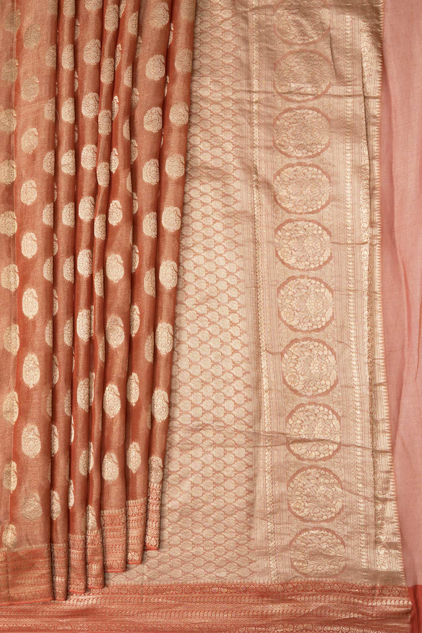 Pleats and pallu of Brick Orange Dual Tone Mysore Georgette Saree with Zari Brocade on the body and Zari Border. 