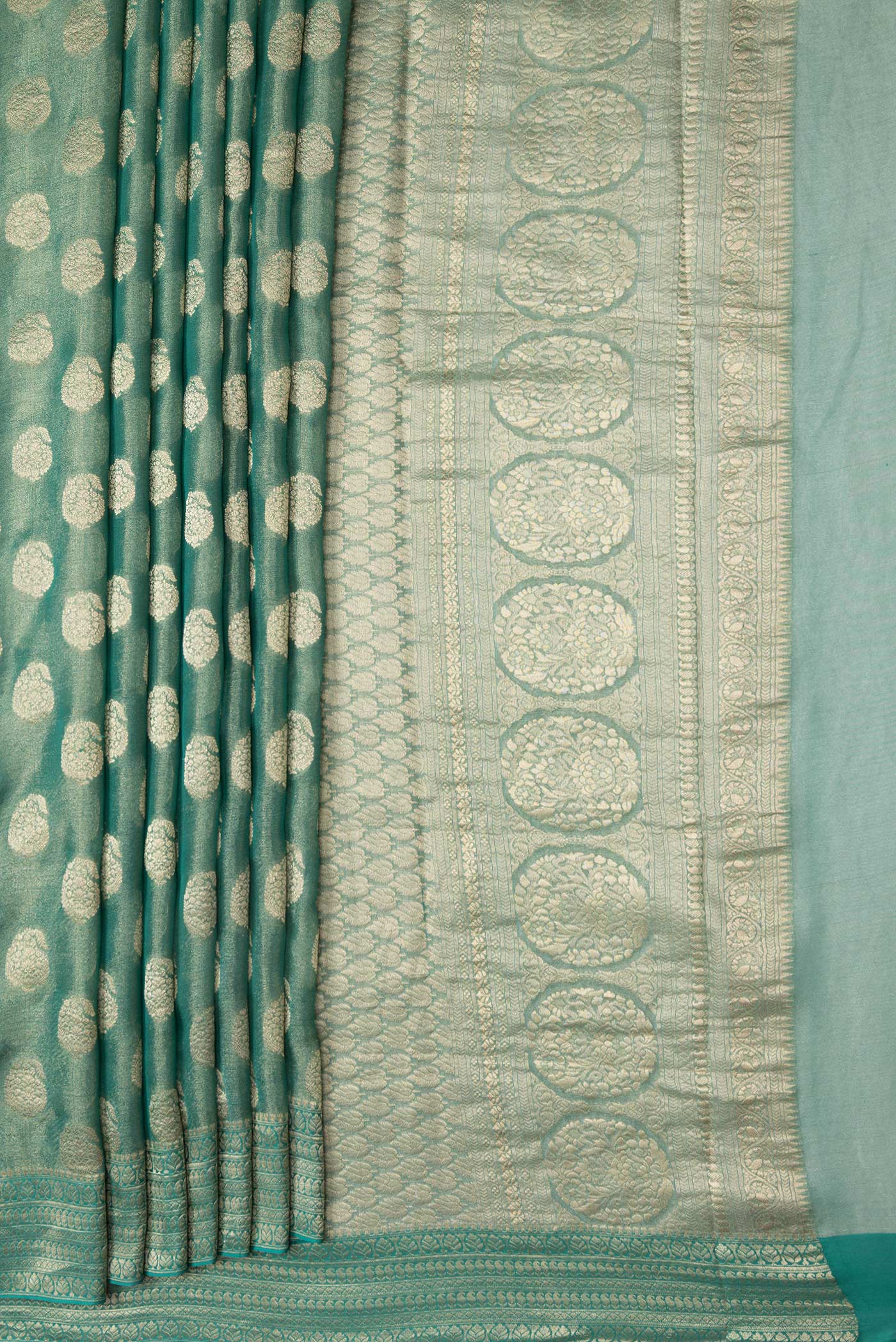 Pleats and pallu of Sea Green Dual Tone Mysore Georgette Saree with Zari Brocade on the body and Zari Border. 