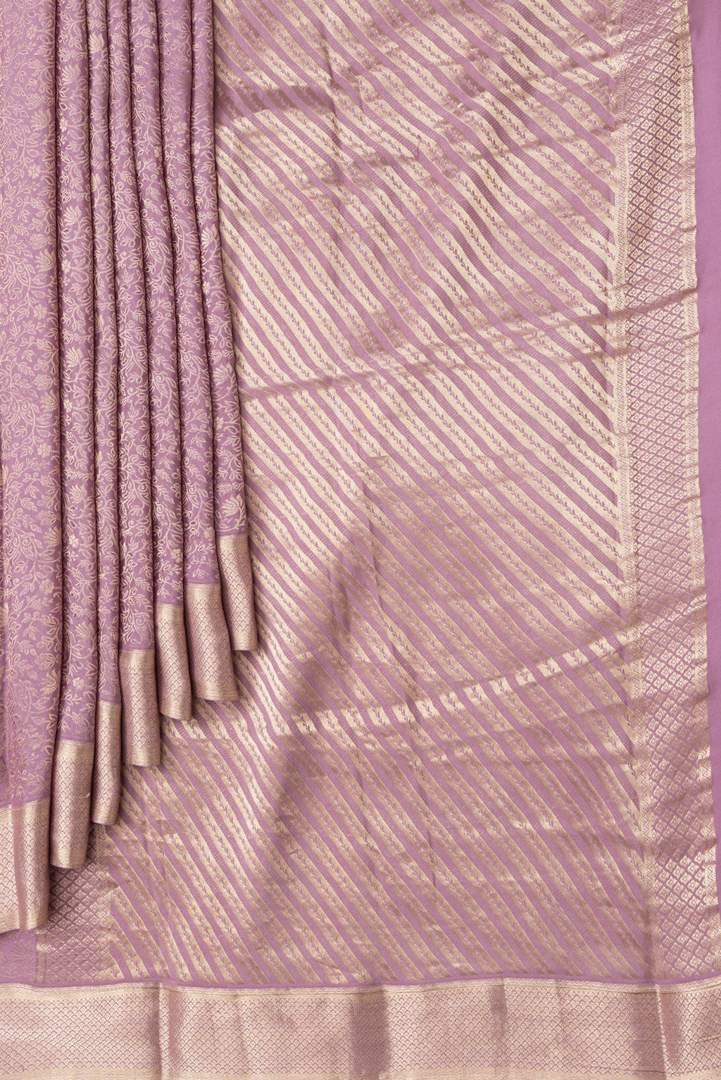 Pleats and pallu of Purple Dual Tone Georgette Saree with Zari Brocade on the body and Zari Border. 