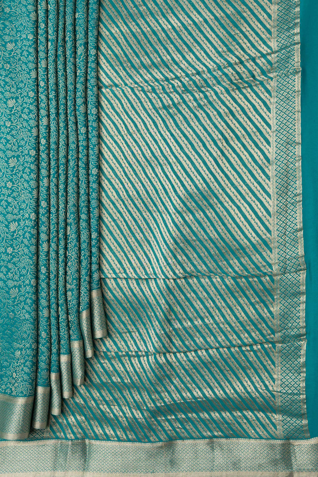 Pleats and pallu of Sky Blue Dual Tone Georgette Saree with Zari Brocade on the body and Zari Border. 