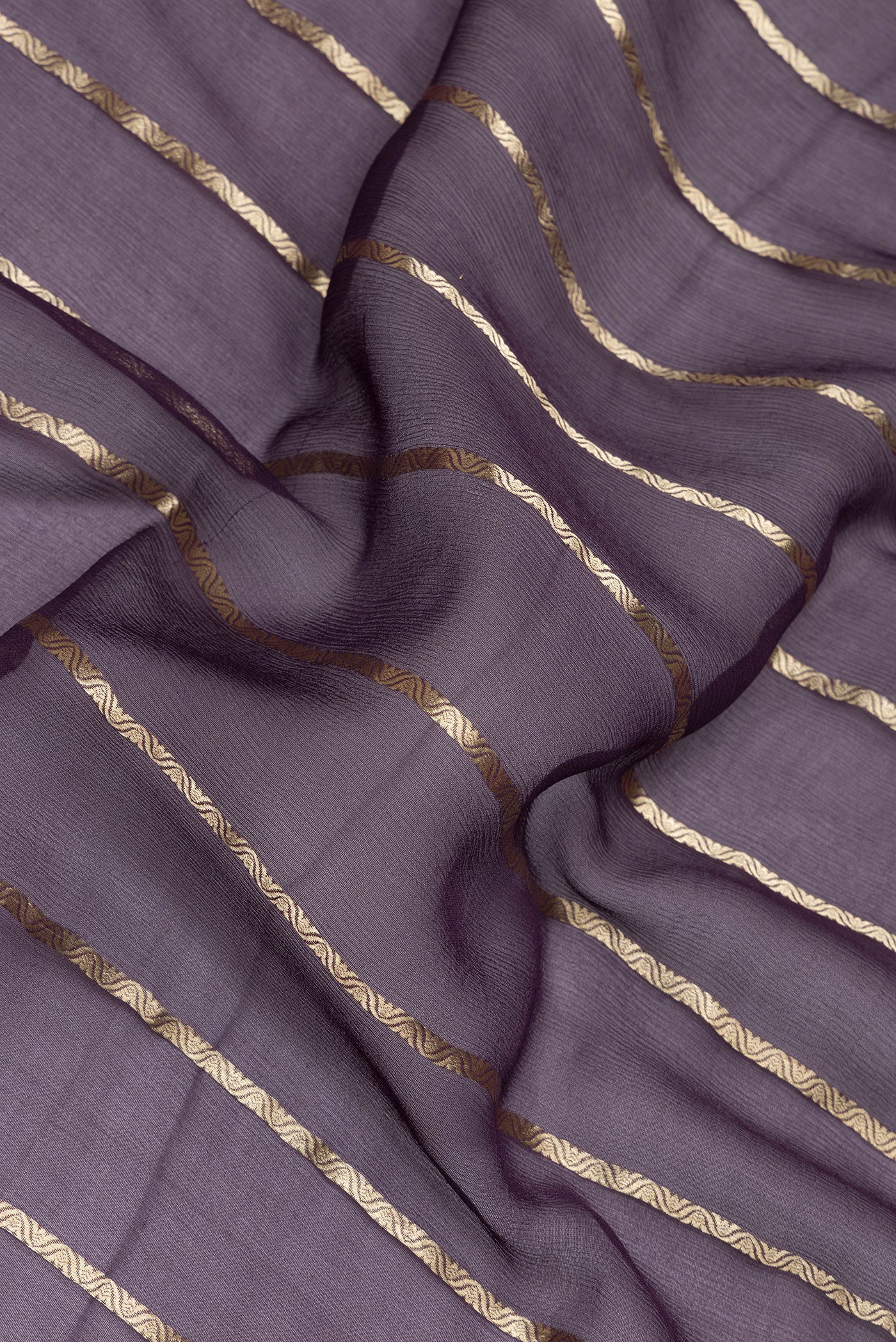 Close up of Purple Mysore Chiffon Saree with Stripes on the body and Zari Border.  displaying folds