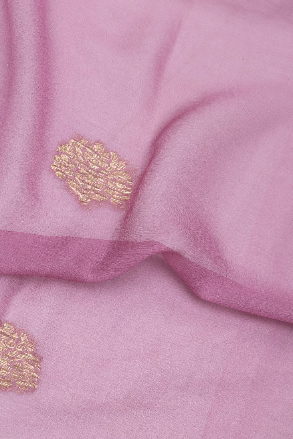 Close up of Lavender Mysore Chiffon Saree with Zari Butta on the body and Zari Border.  displaying folds