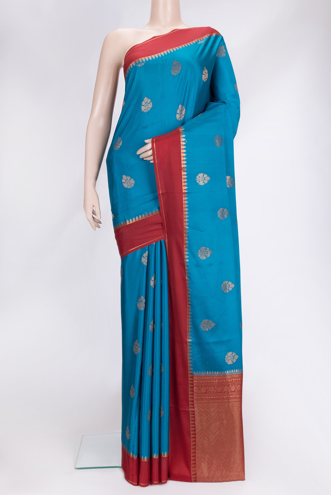 Sky Blue Dual Tone Mysore Silk Saree with Zari Butta on the body and Zari Border.  displayed on a mannequin