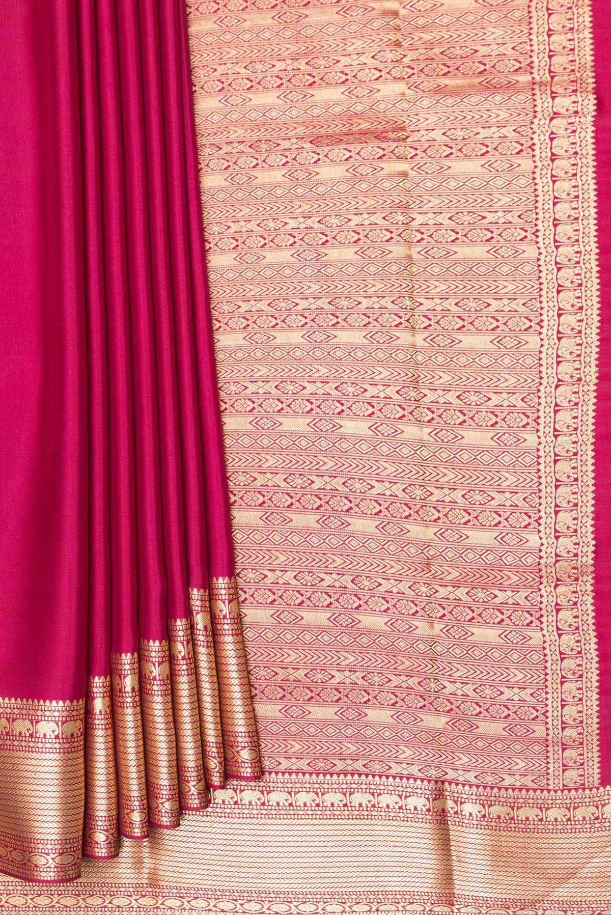 Pleats and pallu of Pure Silk Dark Pink Mysore Crepe Saree with Plain Body and Zari Border. 