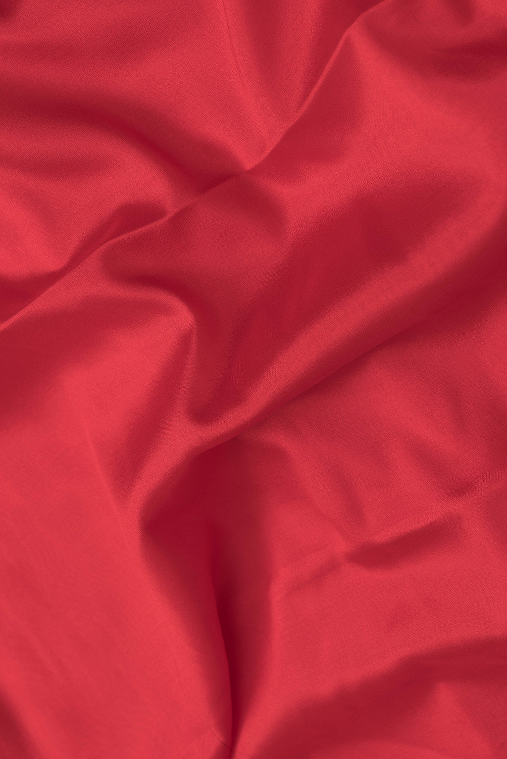 Close up of Red Dual Tone Mysore Silk Saree with Plain Body and Fancy Border.  displaying folds
