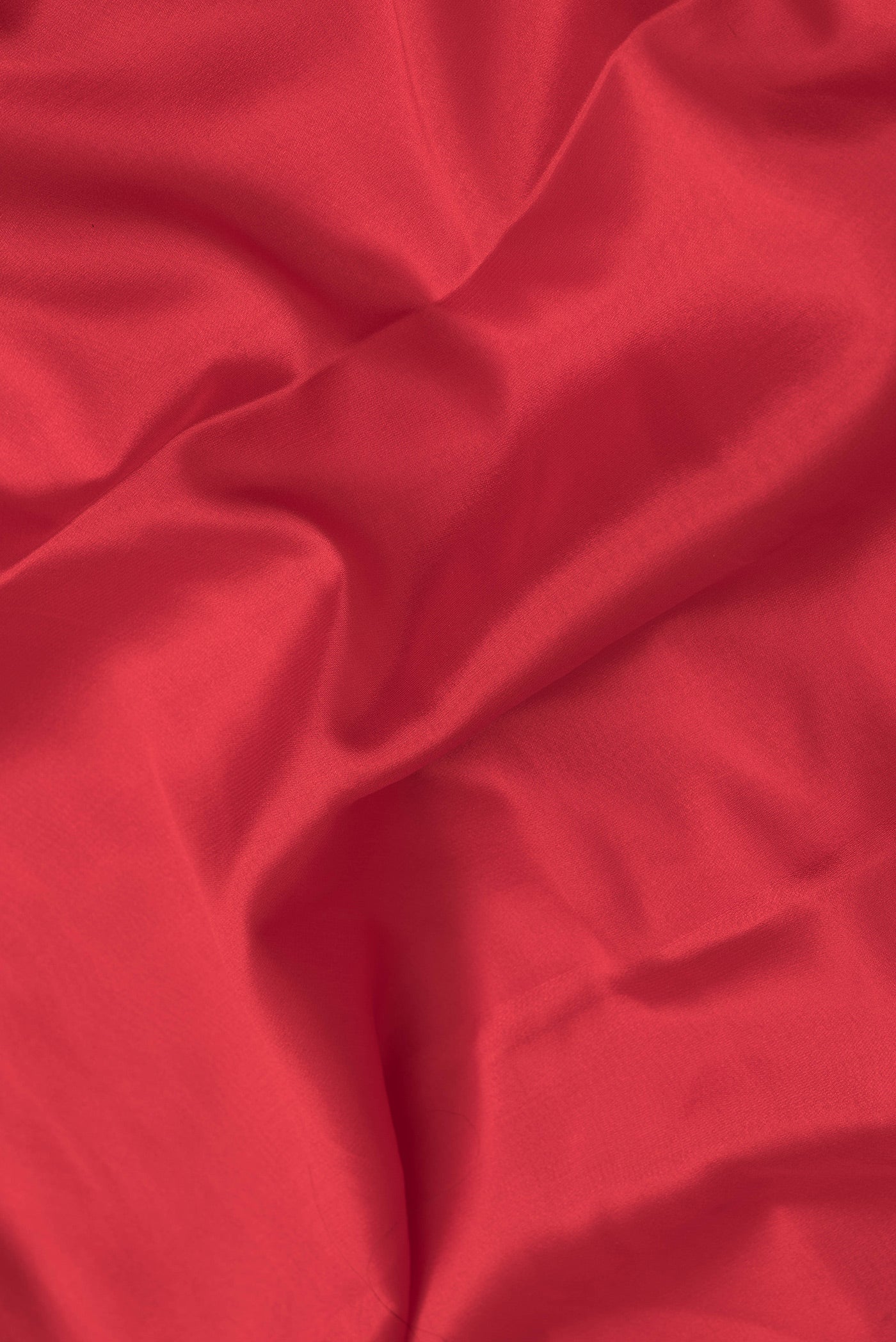 Close up of Red Dual Tone Mysore Silk Saree with Plain Body and Fancy Border.  displaying folds