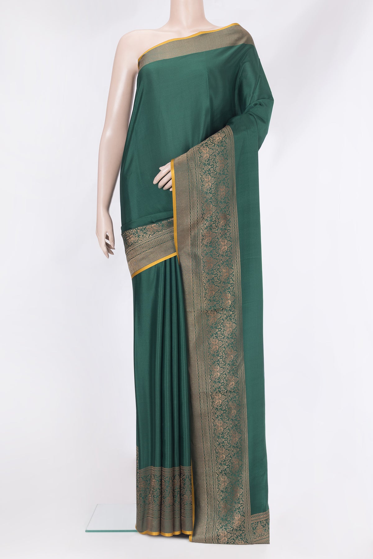 Bottle Green Mysore Silk Saree with Plain Body and Zari Border.  displayed on a mannequin