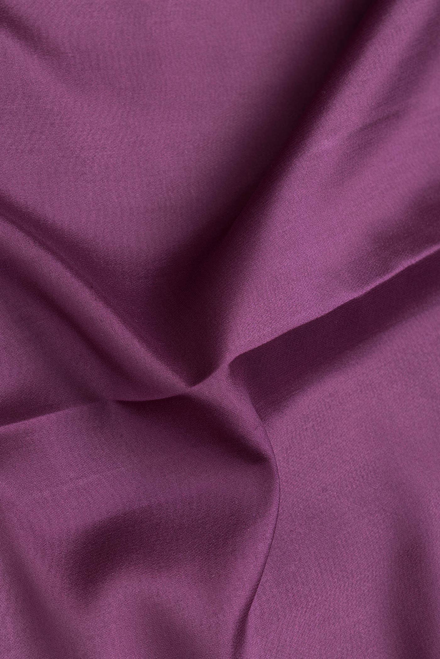 Close up of Burgundy Dual Tone Mysore Silk Saree with Plain Body and Zari Border.  displaying folds