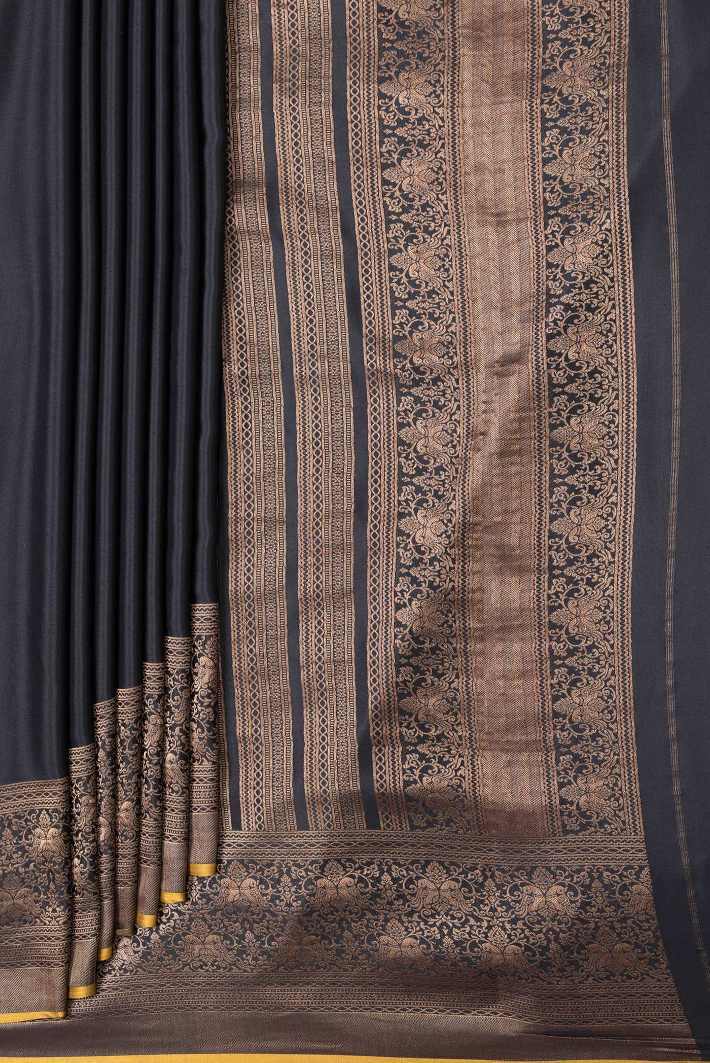 Pleats and pallu of Black Dual Tone Mysore Silk Saree with Zari Butta on the body and Zari Border. 