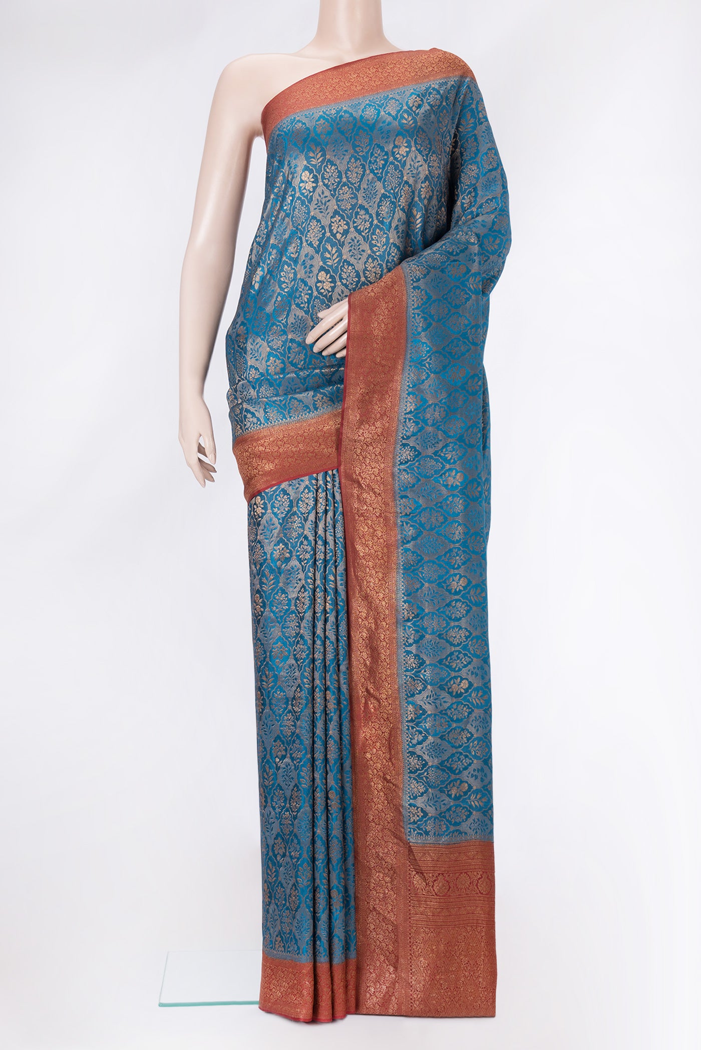 Peacock Blue Mysore Crepe Saree with Zari Brocade on the body and Zari Border.  displayed on a mannequin
