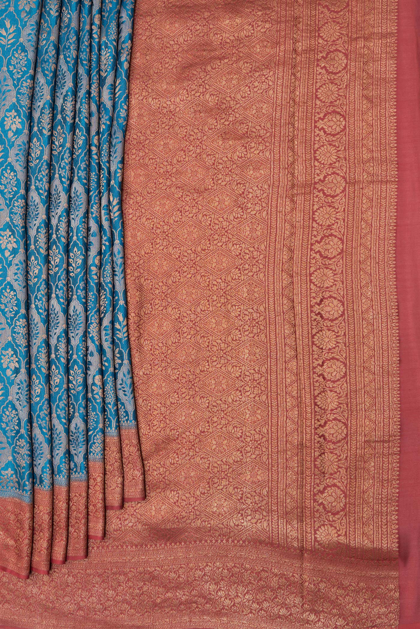 Pleats and pallu of Peacock Blue Mysore Crepe Saree with Zari Brocade on the body and Zari Border. 