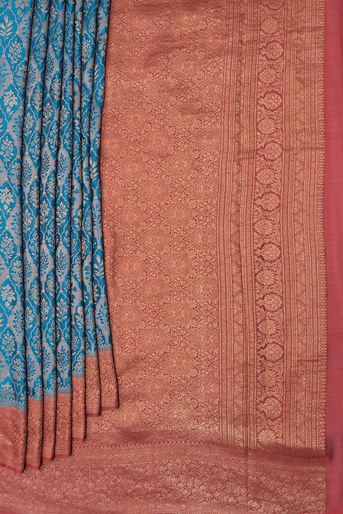 Pleats and pallu of Peacock Blue Mysore Crepe Saree with Zari Brocade on the body and Zari Border. 