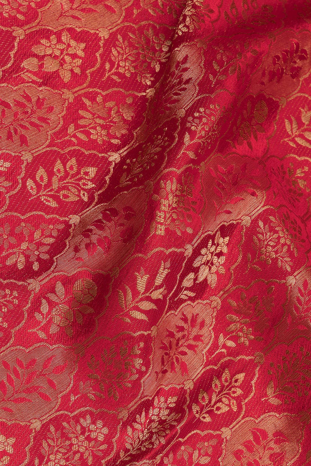 Close up of Maroon Dual Tone Banarasi Georgette Saree with Zari Brocade on the body and Zari Border.  displaying folds