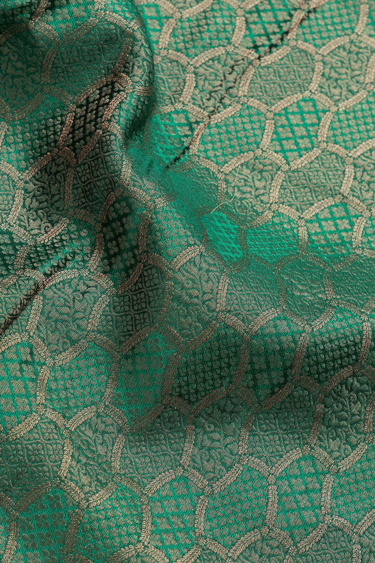 Close up of Bottle Green Dual Tone Georgette Saree with Zari Brocade on the body and Zari Border.  displaying folds