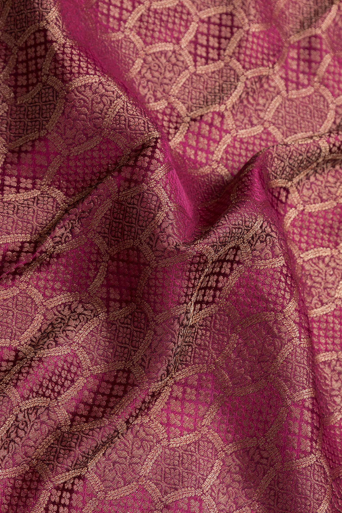 Close up of Magenta Dual Tone Mysore Georgette Saree with Zari Brocade on the body and Zari Border.  displaying folds