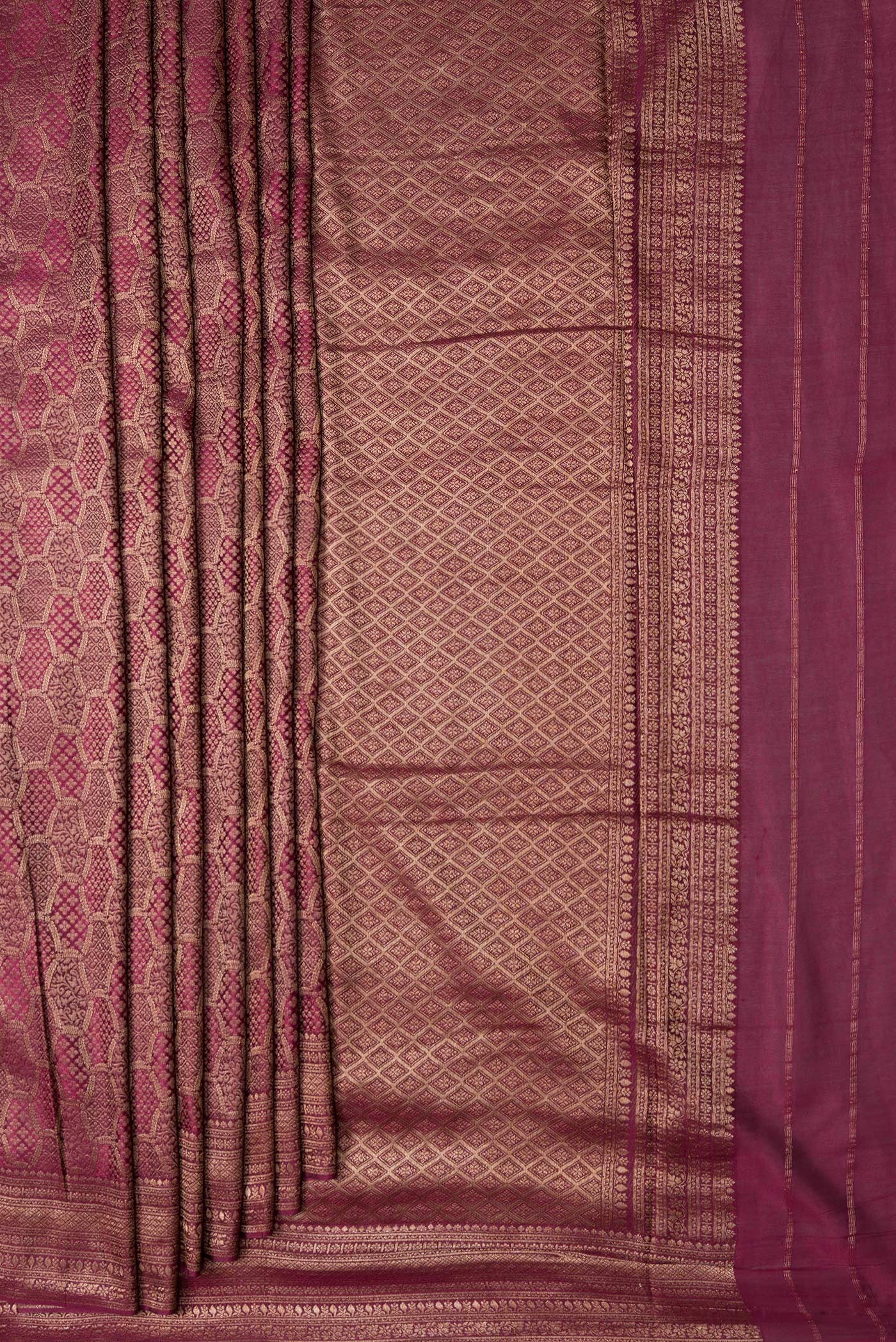 Pleats and pallu of Magenta Dual Tone Mysore Georgette Saree with Zari Brocade on the body and Zari Border. 