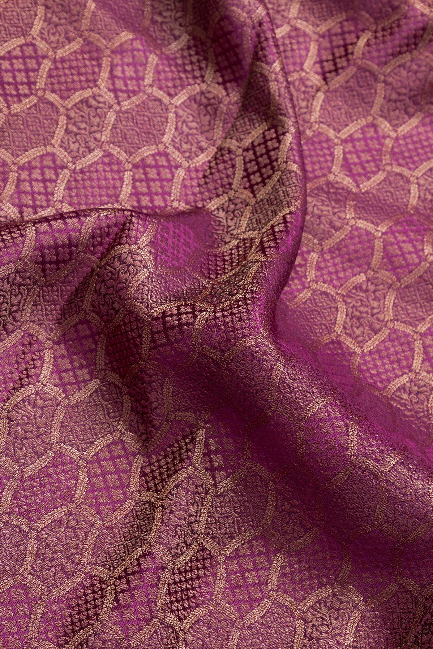 Close up of Purple Dual Tone Mysore Georgette Saree with Zari Brocade on the body and Zari Border.  displaying folds