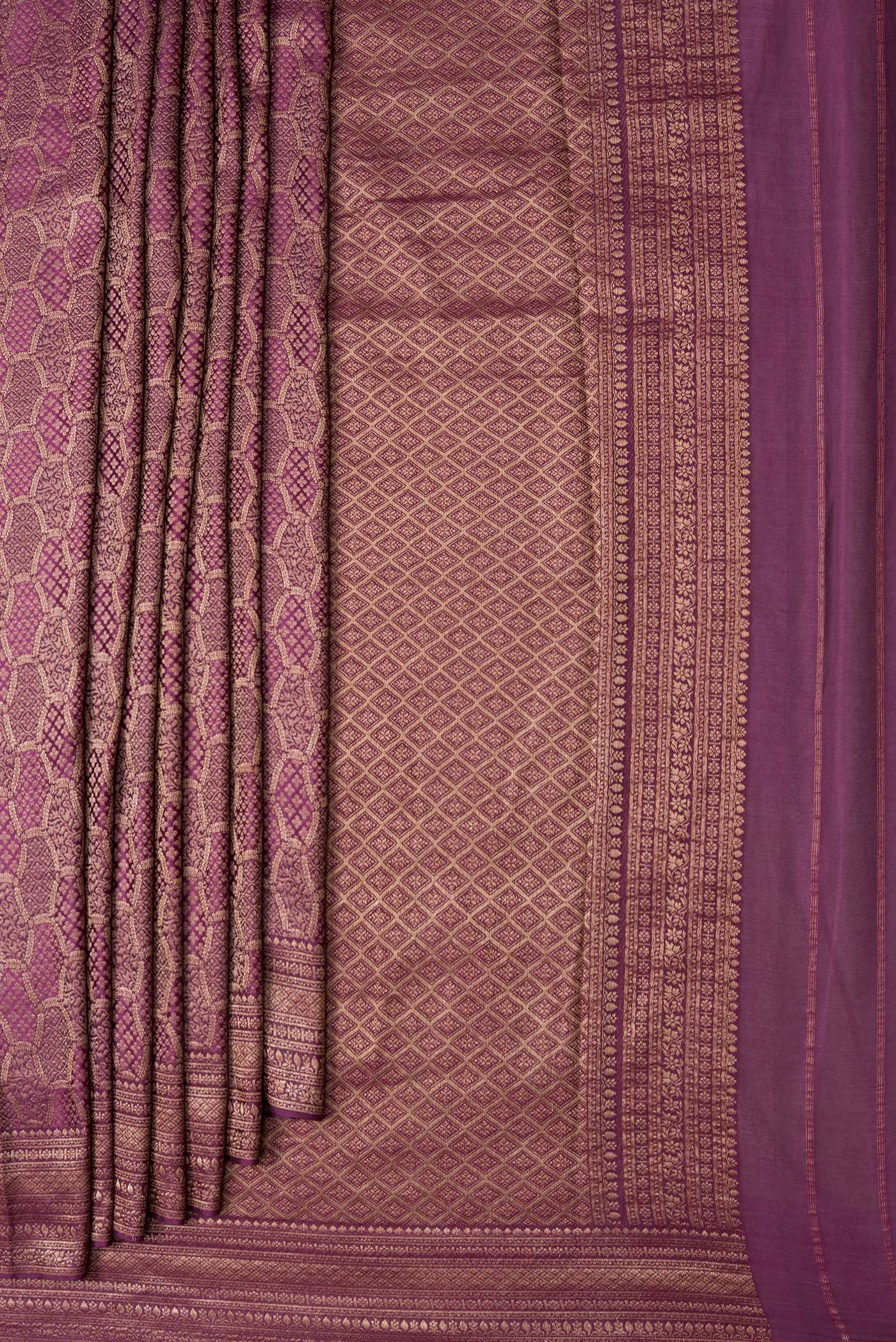 Pleats and pallu of Purple Dual Tone Mysore Georgette Saree with Zari Brocade on the body and Zari Border. 