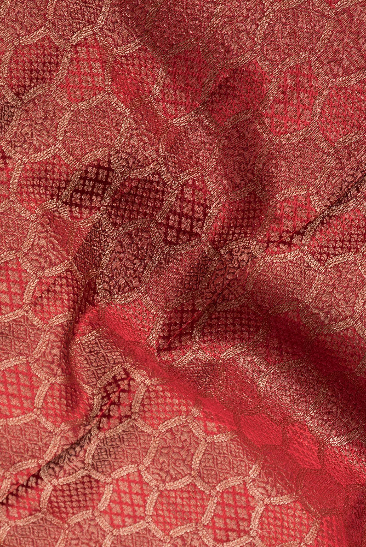 Close up of Maroon Dual Tone Mysore Georgette Saree with Zari Brocade on the body and Zari Border.  displaying folds