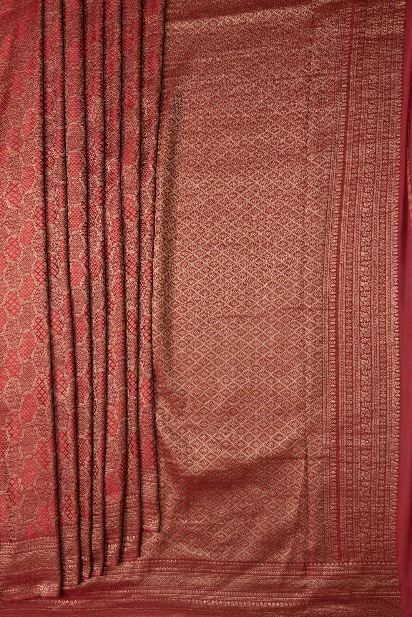 Pleats and pallu of Maroon Dual Tone Mysore Georgette Saree with Zari Brocade on the body and Zari Border. 