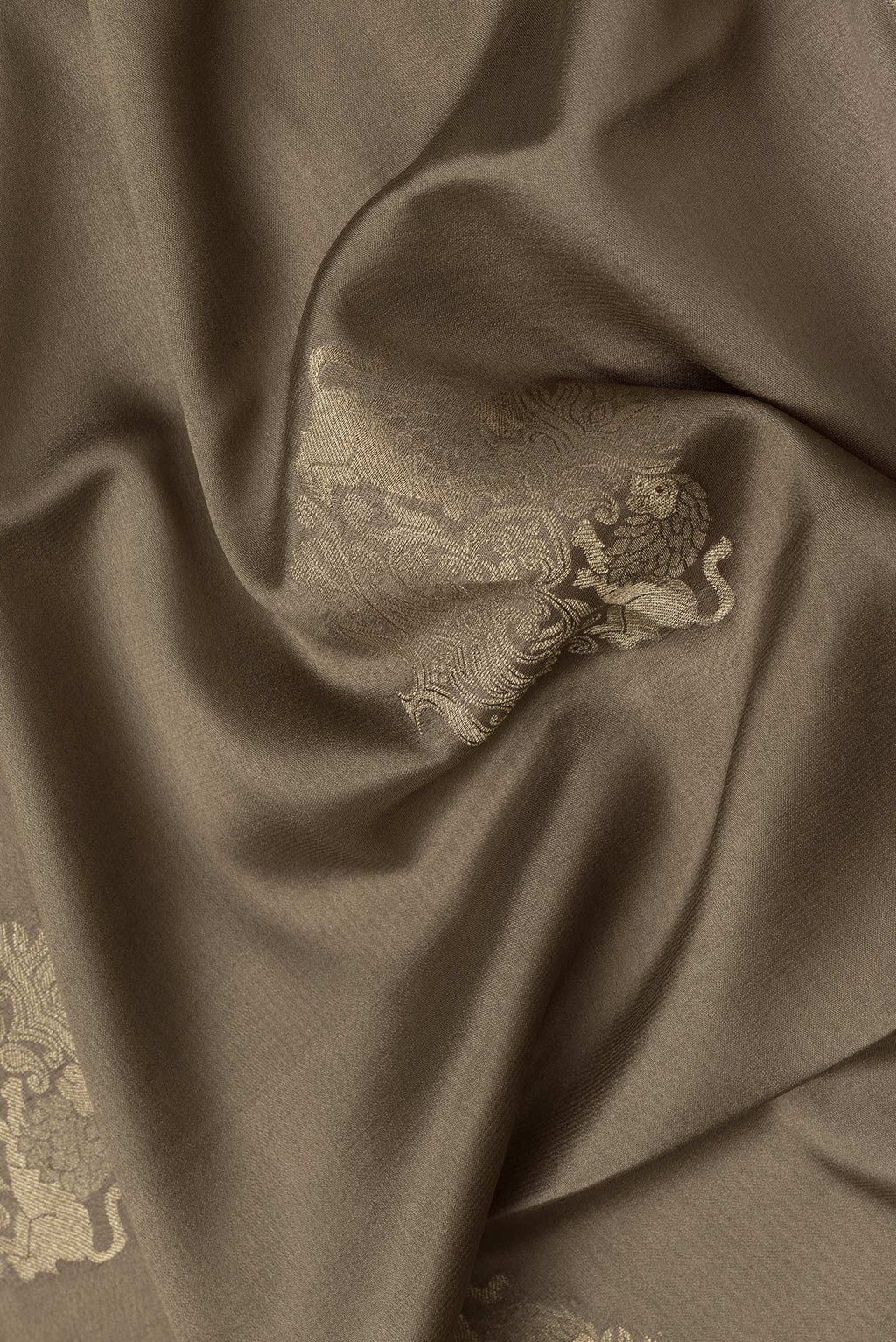 Close up of Mehandi Green Dual Tone Mysore Silk Saree with Zari Butta on the body and Zari Border.  displaying folds