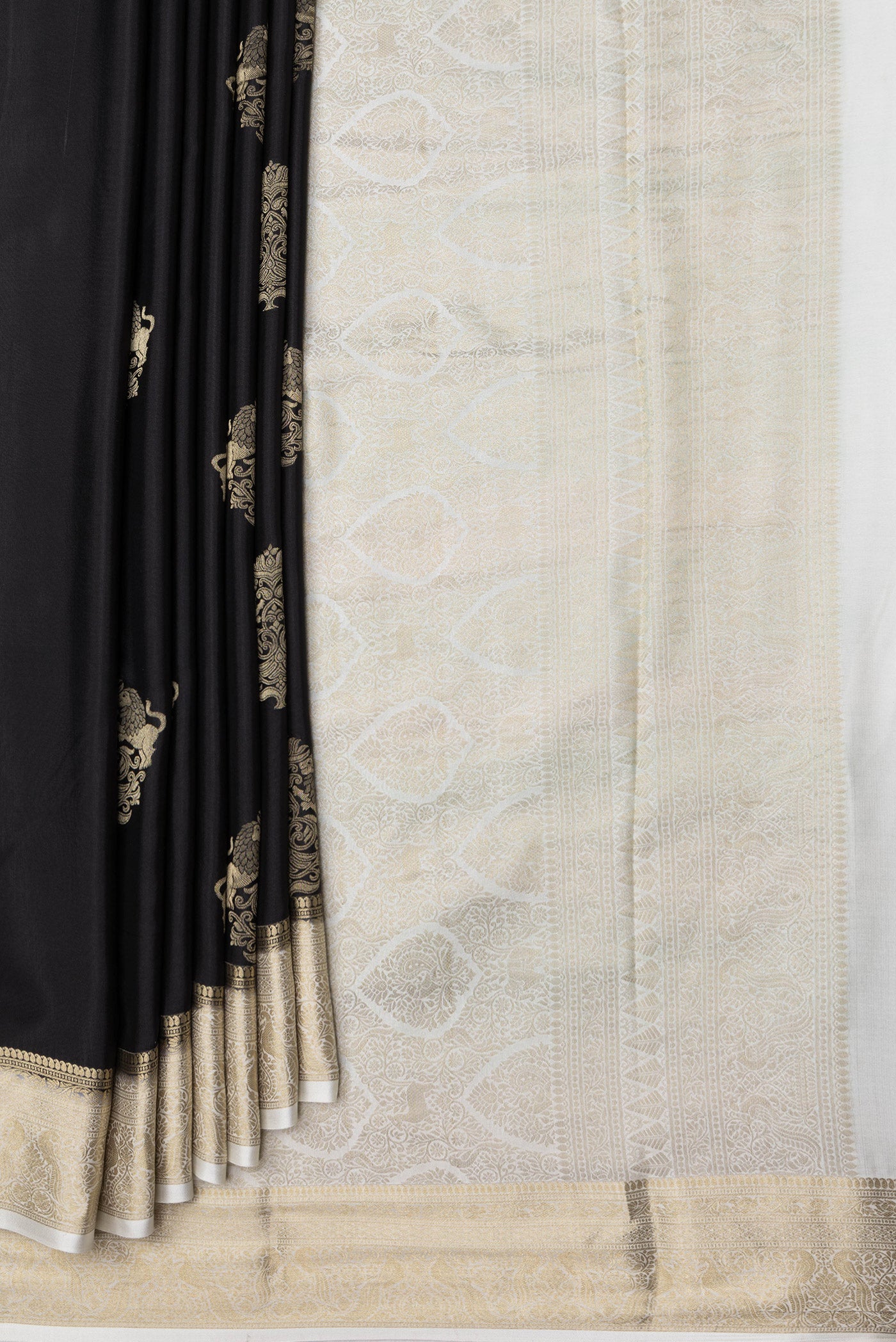 Pleats and pallu of Black Dual Tone Mysore Silk Saree with Zari Butta on the body and Zari Border. 