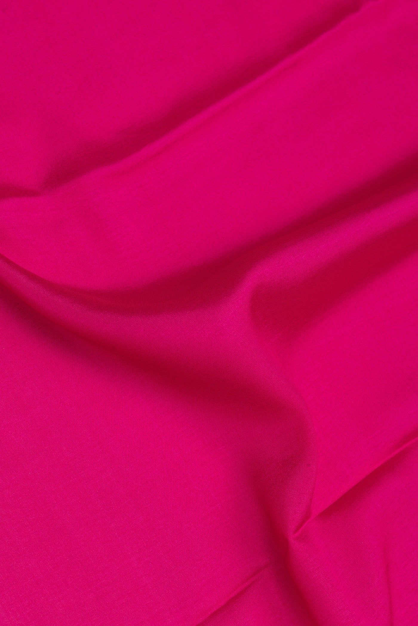 Close up of Pink Mysore Silk Saree with Plain Body and Fancy Border.  displaying folds
