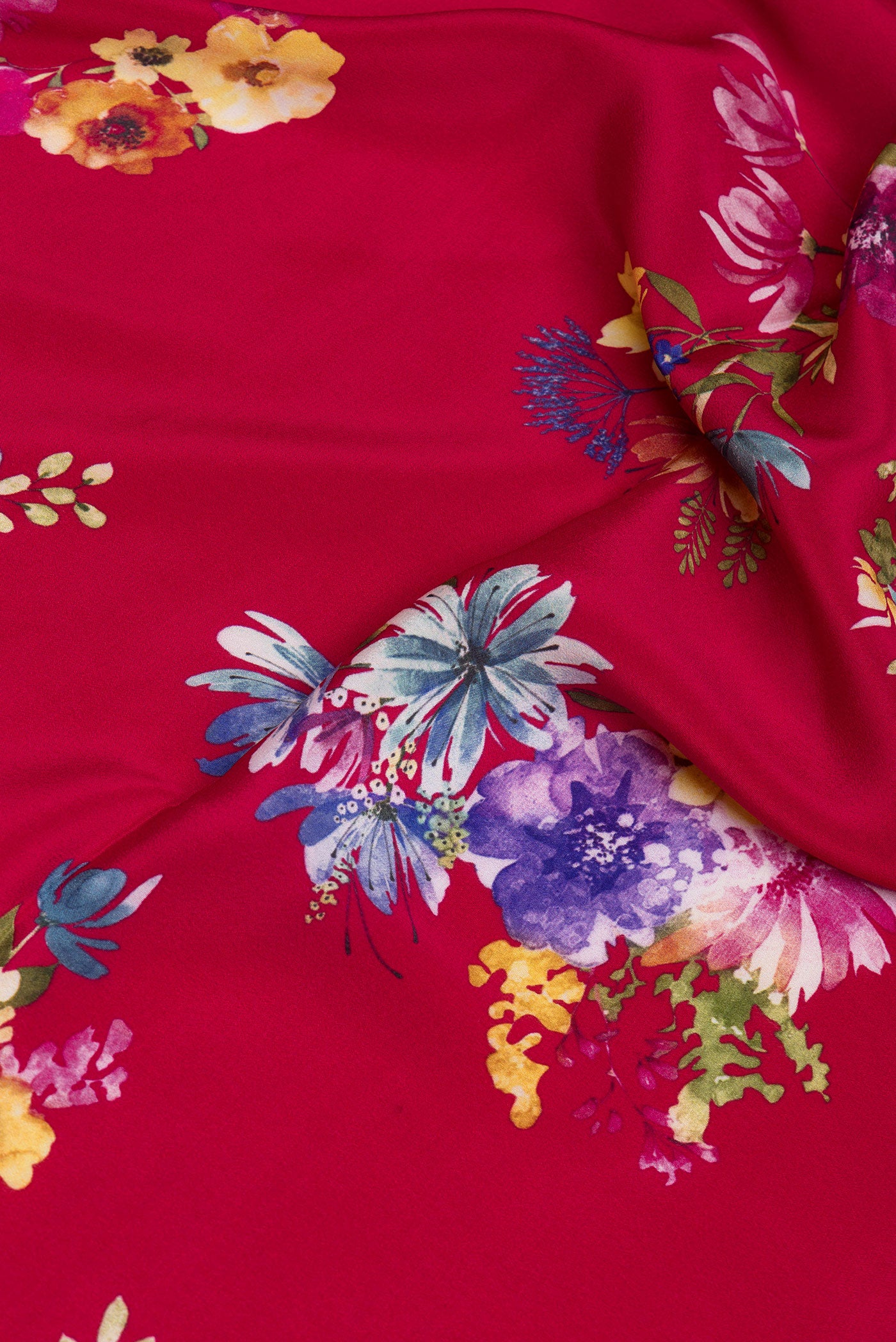 Close up of Maroon Crepe Saree with Floral Print on the body and Without Border.  displaying folds