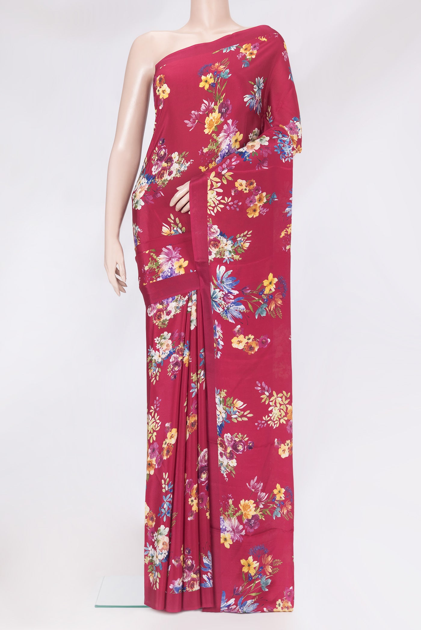 Maroon Crepe Saree with Floral Print on the body and Without Border.  displayed on a mannequin