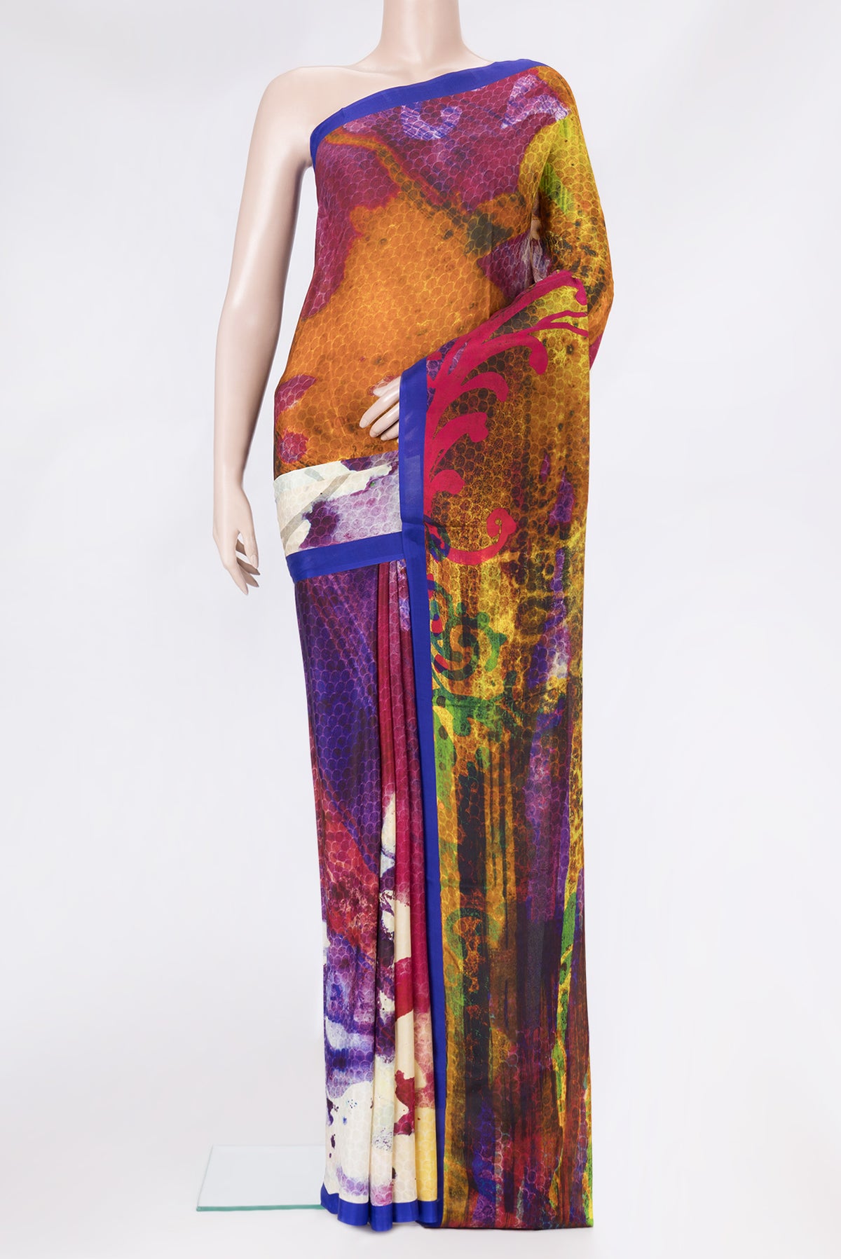 Multi Color Crepe Saree with Printed design on the body and Plain Border.  displayed on a mannequin